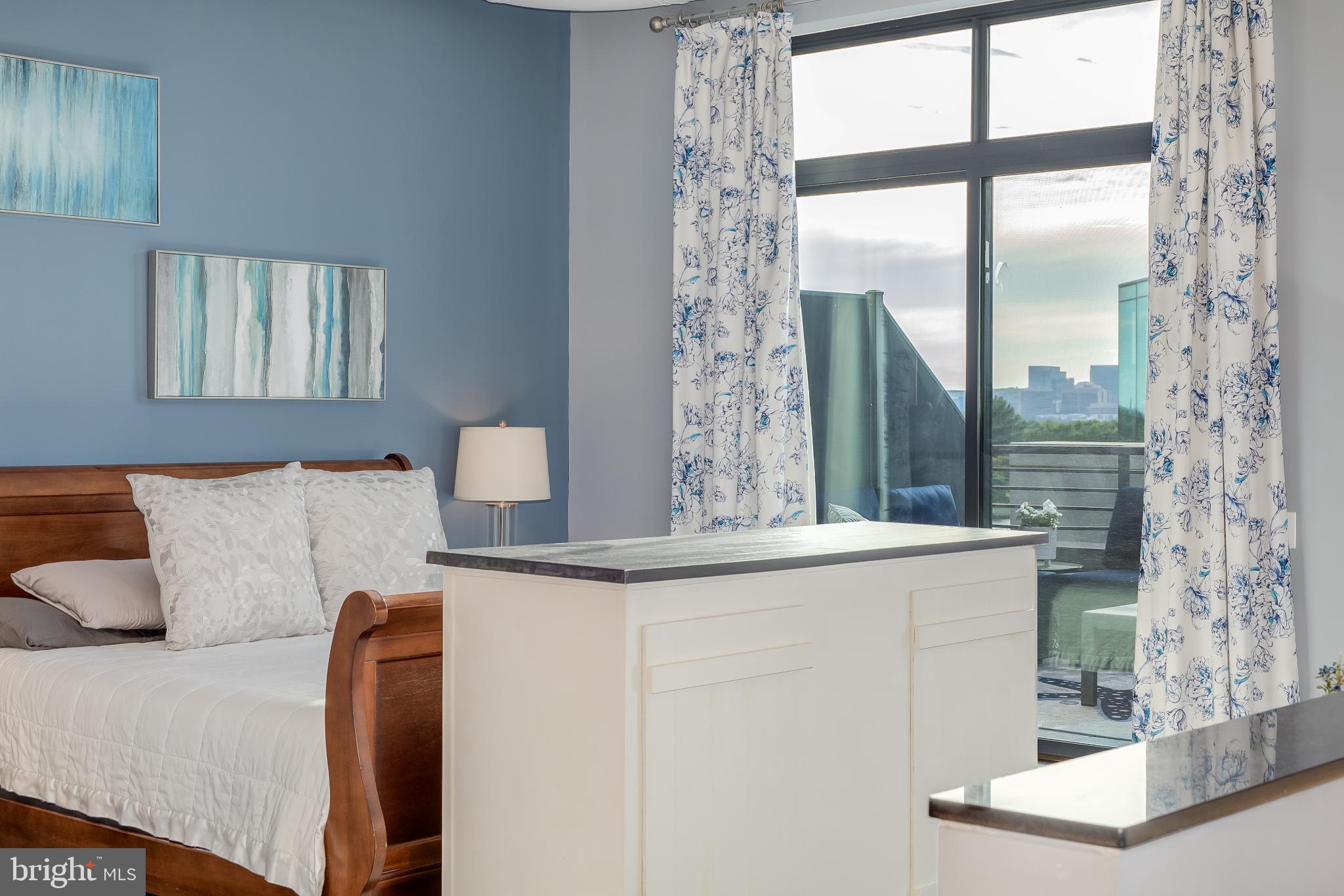 525 Water Street Southwest, Unit 403 Washington, DC 20024 - Photo 24 of 35 a living room with a couch and windows