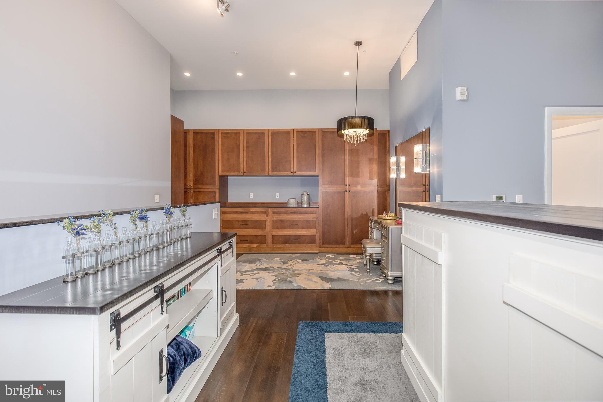 525 Water Street Southwest, Unit 403 Washington, DC 20024 - Photo 26 of 35 a kitchen with stainless steel appliances kitchen island granite countertop a refrigerator and a stove