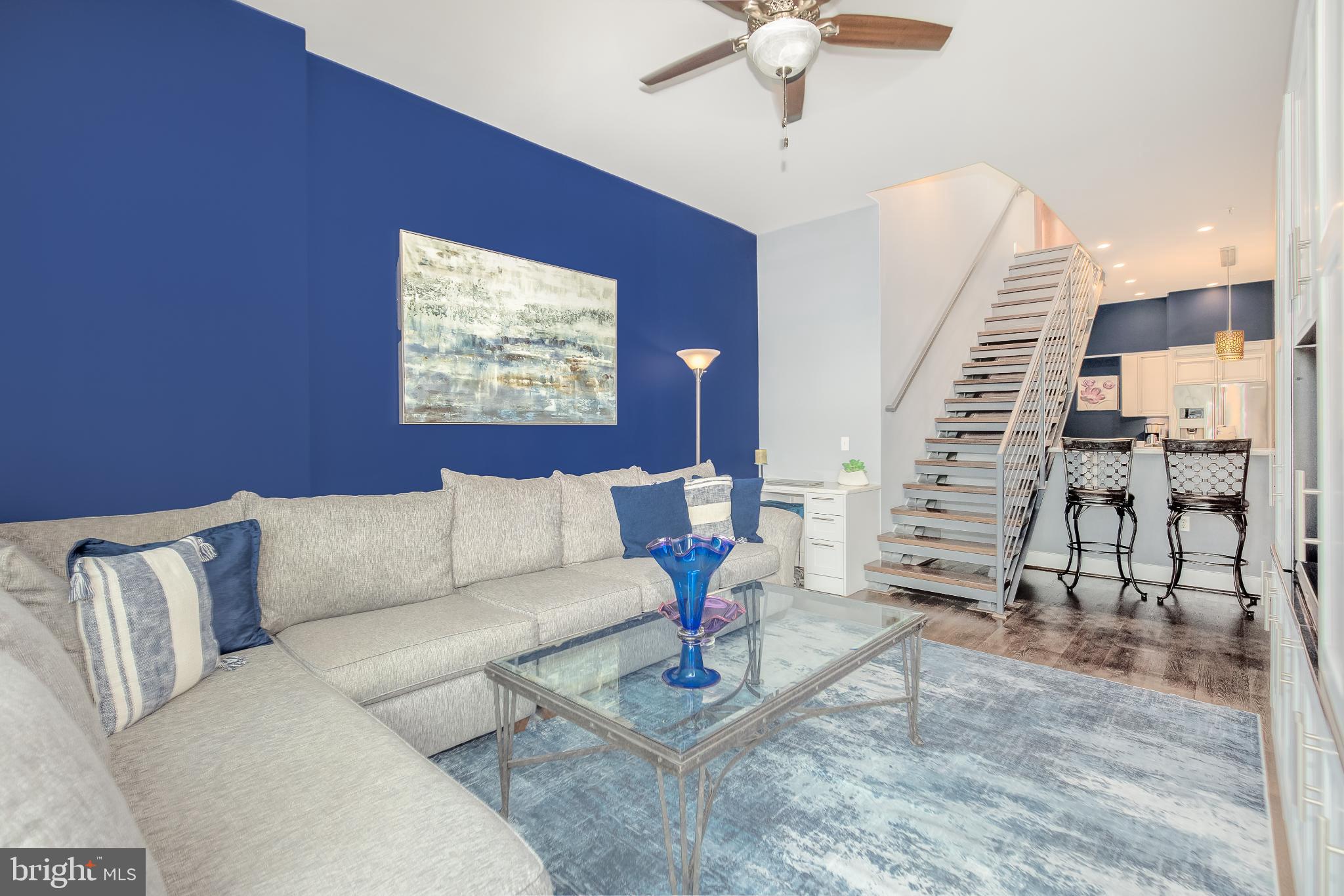 525 Water Street Southwest, Unit 403 Washington, DC 20024 - Photo 8 of 35 a living room with furniture and wooden floor