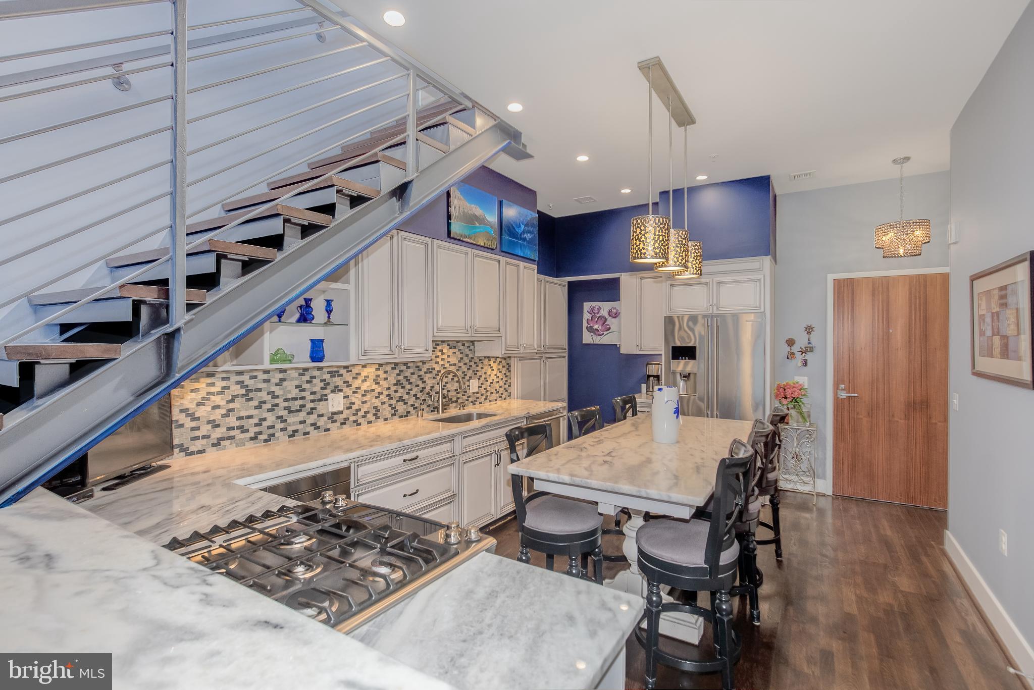 525 Water Street Southwest, Unit 403 Washington, DC 20024 - Photo 10 of 35 a large kitchen with a table and chairs in it