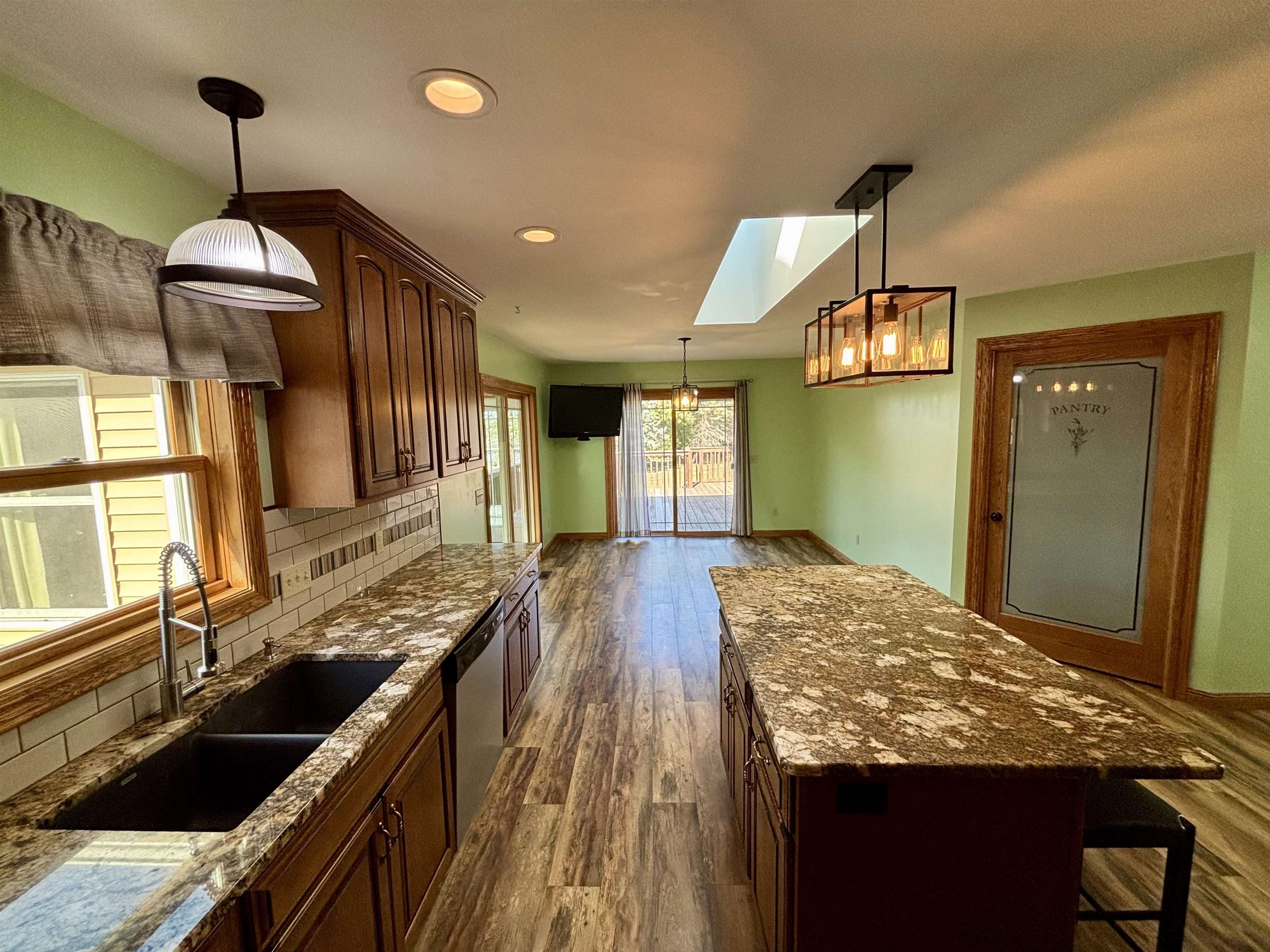 3310 South Apple River Road Elizabeth, IL 61028 - Photo 14 of 39 a kitchen with sink and refrigerator