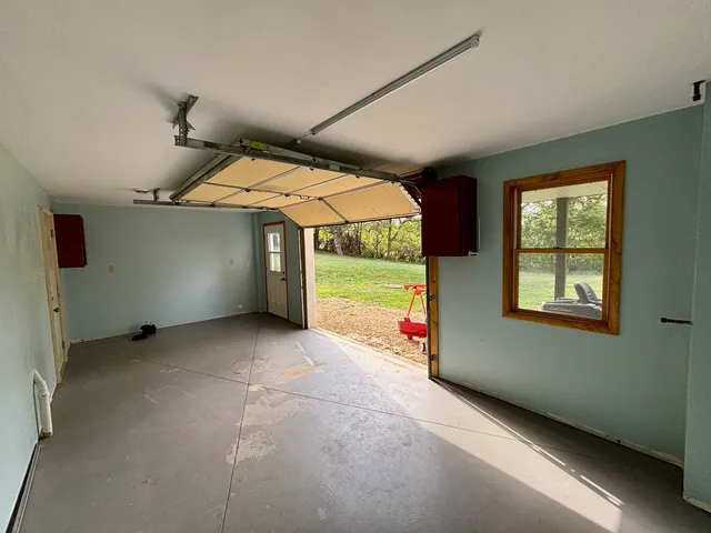 a view of deck with wooden floor and fence with a barbeque