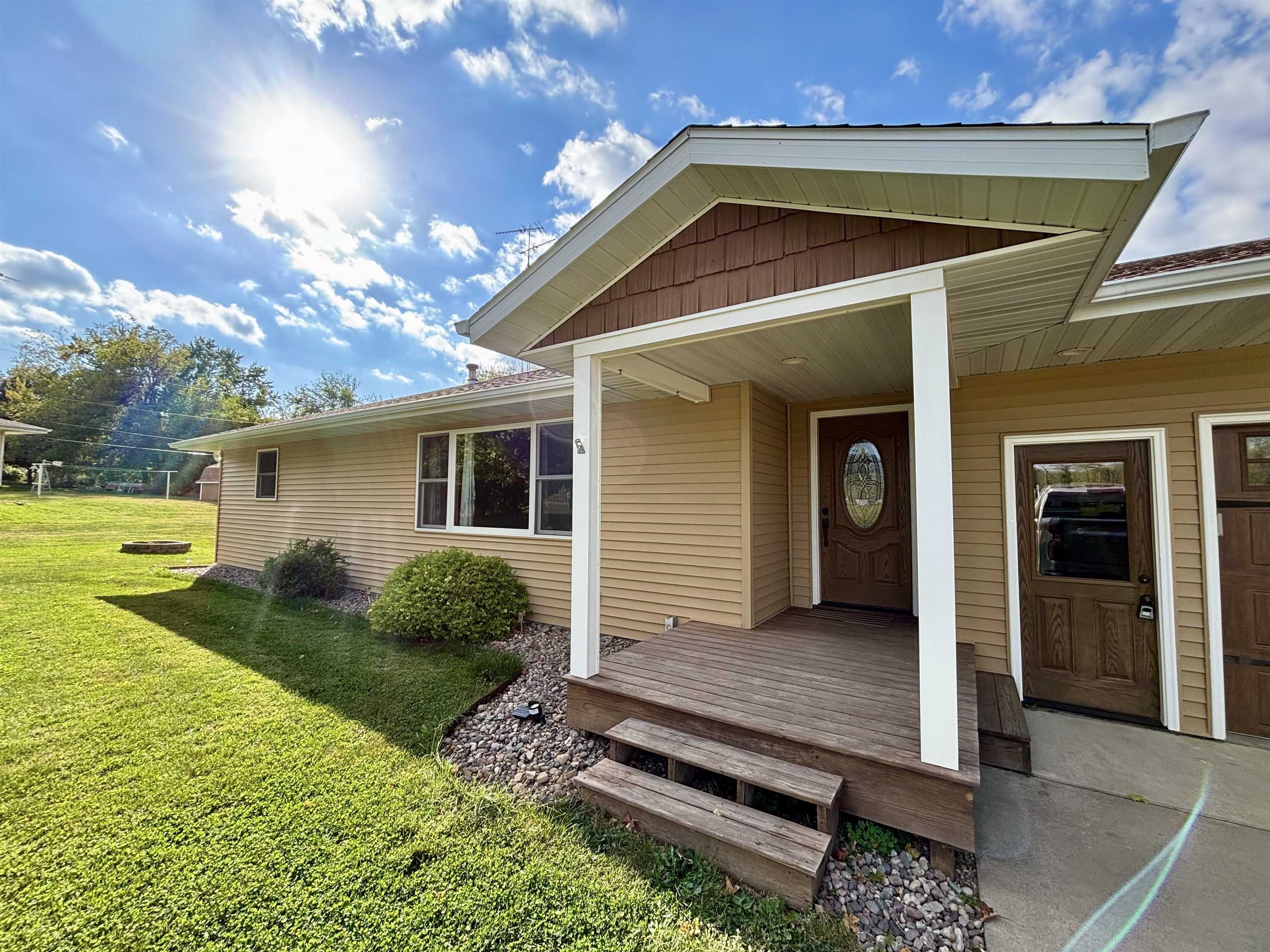 3310 South Apple River Road Elizabeth, IL 61028 - Photo 3 of 39 a front view of a house with garden