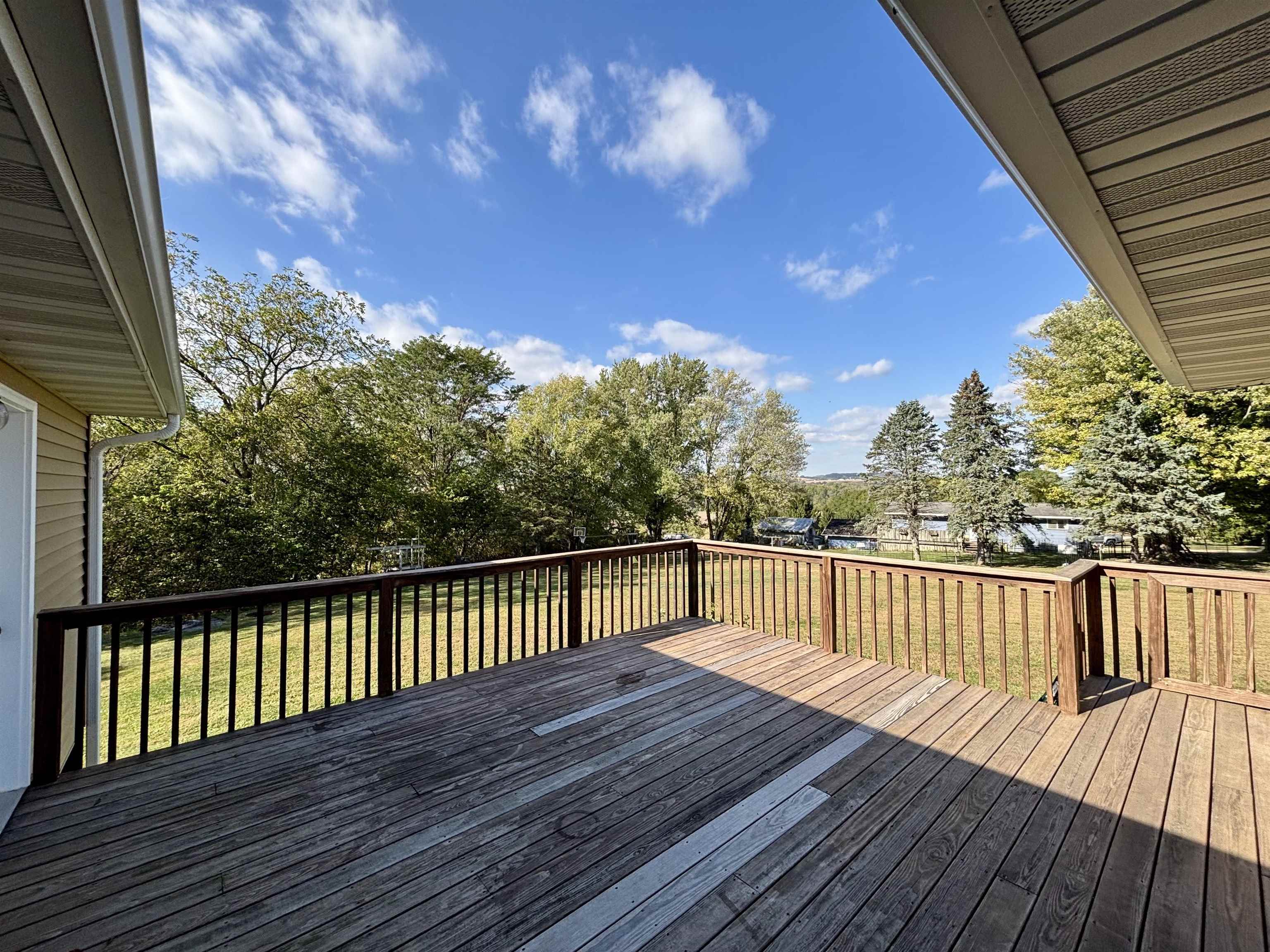 3310 South Apple River Road Elizabeth, IL 61028 - Photo 32 of 39 a view of deck with wooden floor and fence with a barbeque