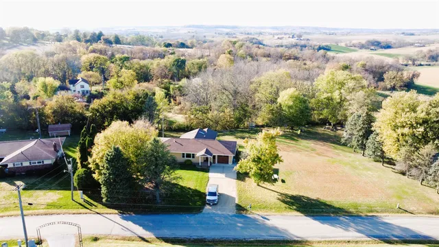 a view of a house with a backyard