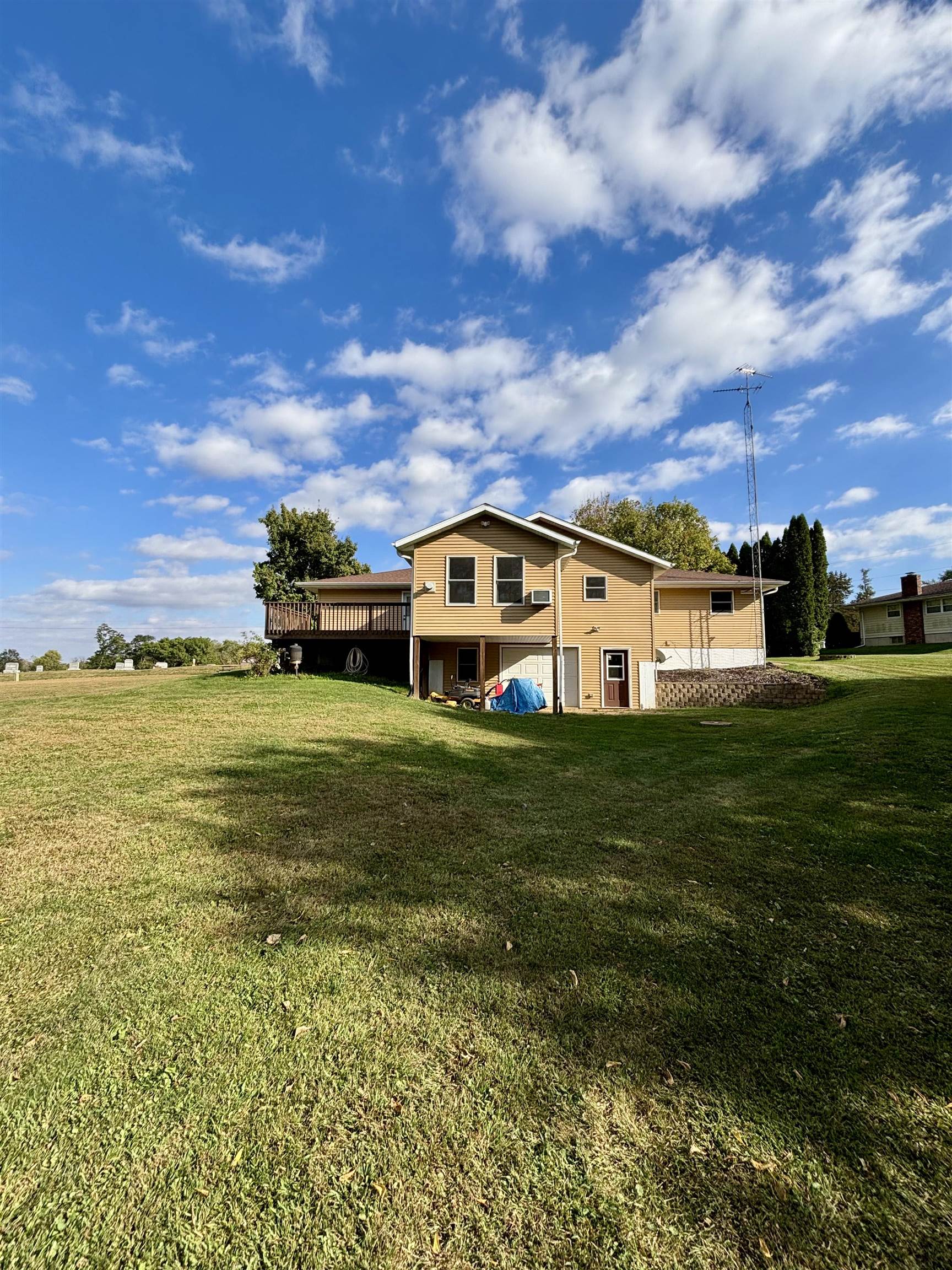 3310 South Apple River Road Elizabeth, IL 61028 - Photo 5 of 39 a view of a big house with a big yard