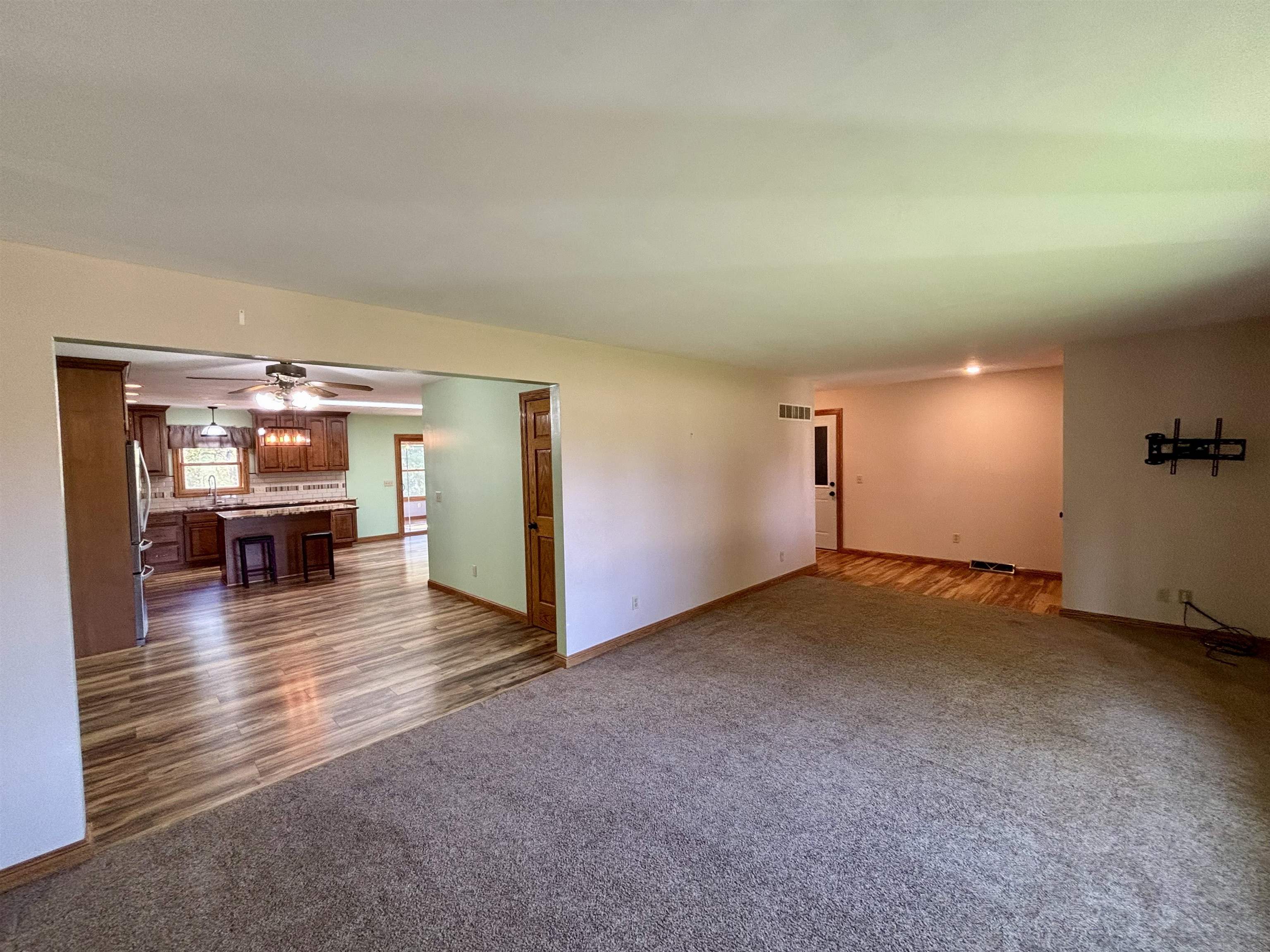 3310 South Apple River Road Elizabeth, IL 61028 - Photo 10 of 39 a view of a livingroom with furniture and an umbrella