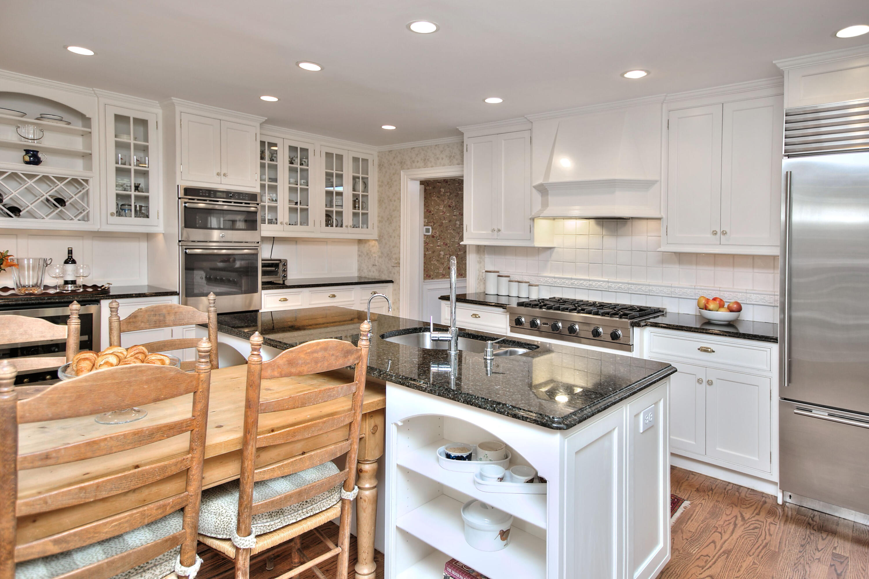 22 Mill Road New Canaan, CT 06840 - Photo 19 of 42 a kitchen with stainless steel appliances granite countertop a sink stove and refrigerator