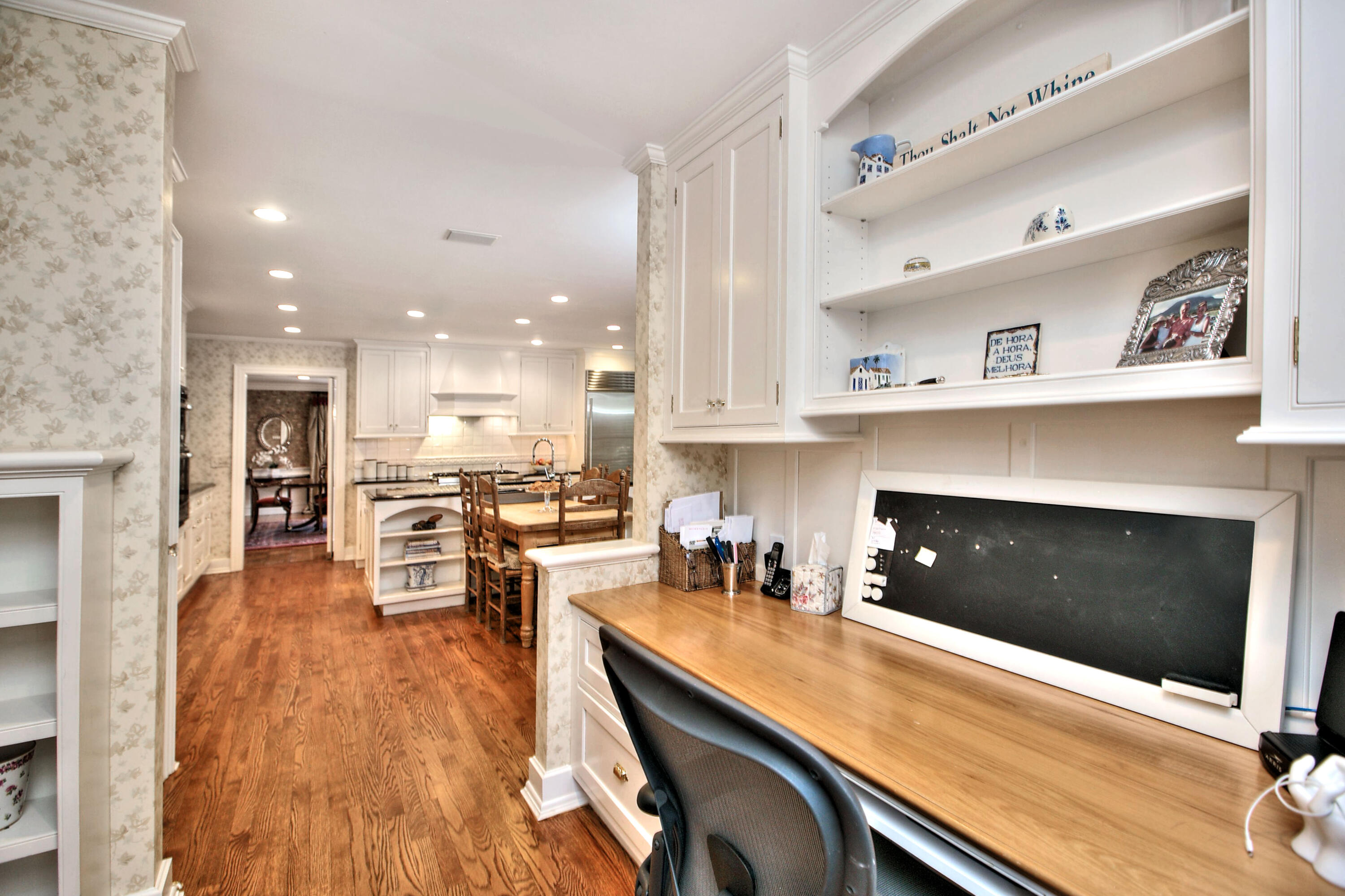 22 Mill Road New Canaan, CT 06840 - Photo 22 of 42 a kitchen with a table chairs refrigerator and cabinets