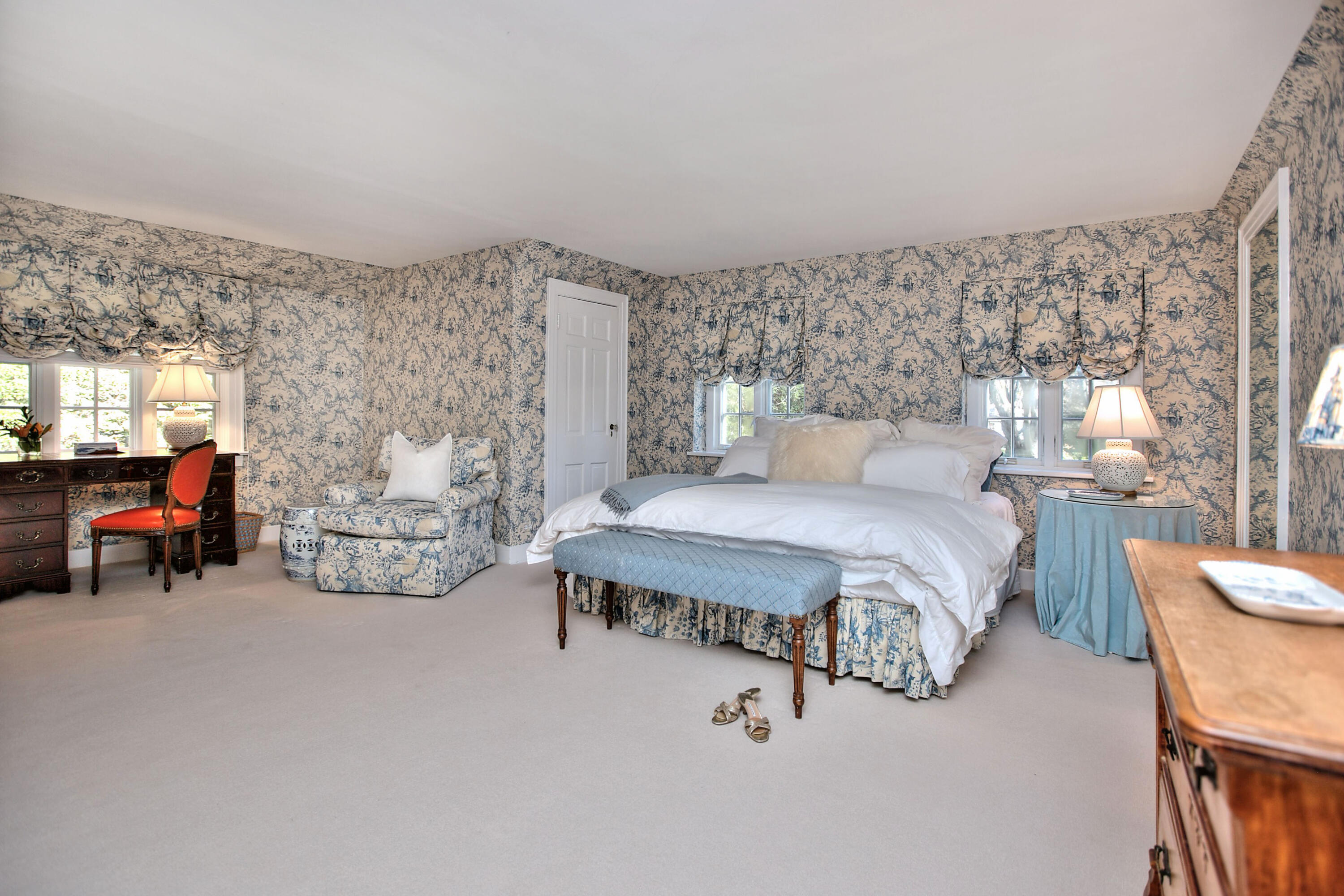 22 Mill Road New Canaan, CT 06840 - Photo 28 of 42 a spacious bedroom with a bed and a couch