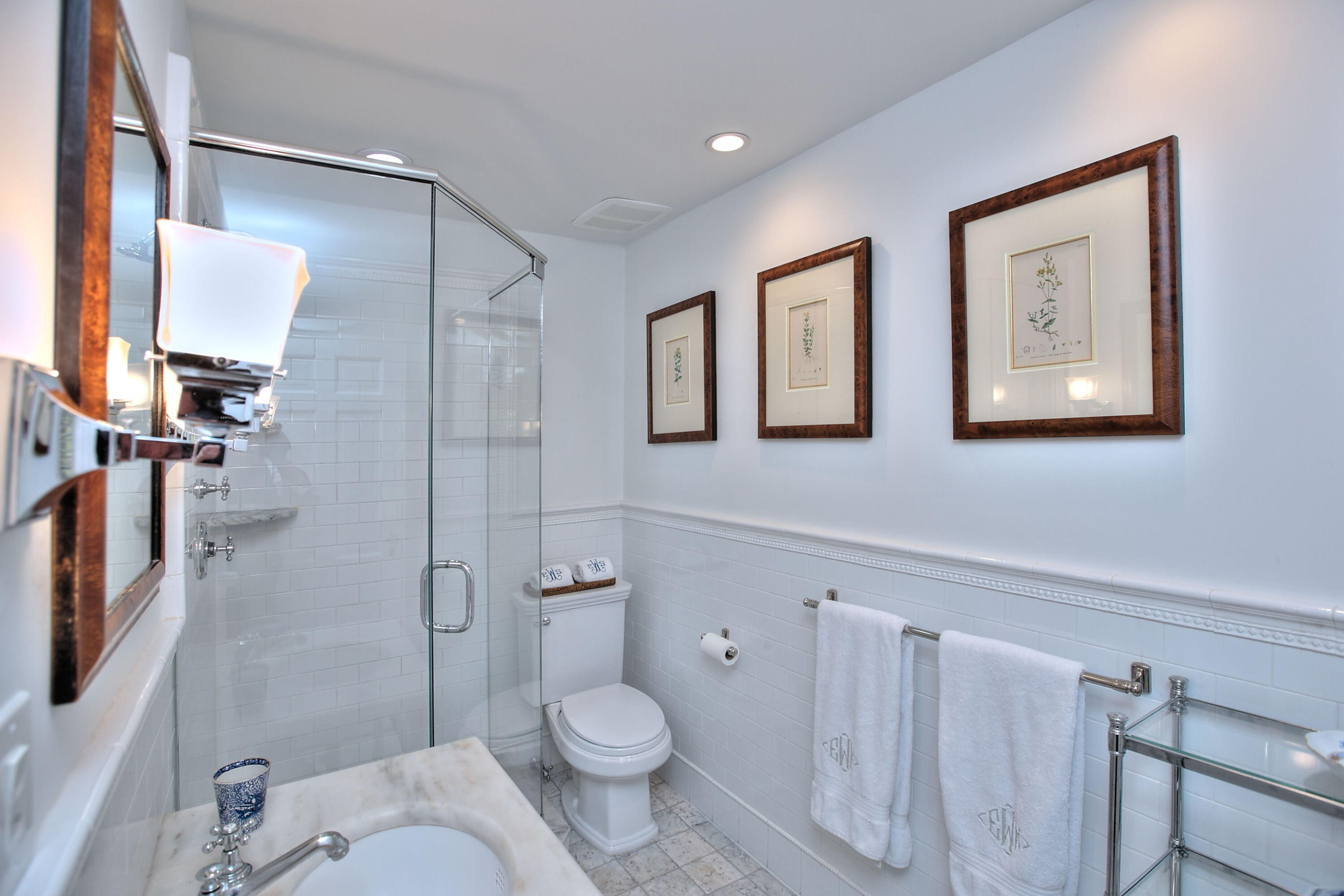 22 Mill Road New Canaan, CT 06840 - Photo 29 of 42 a bathroom with a toilet sink a shower and a mirror