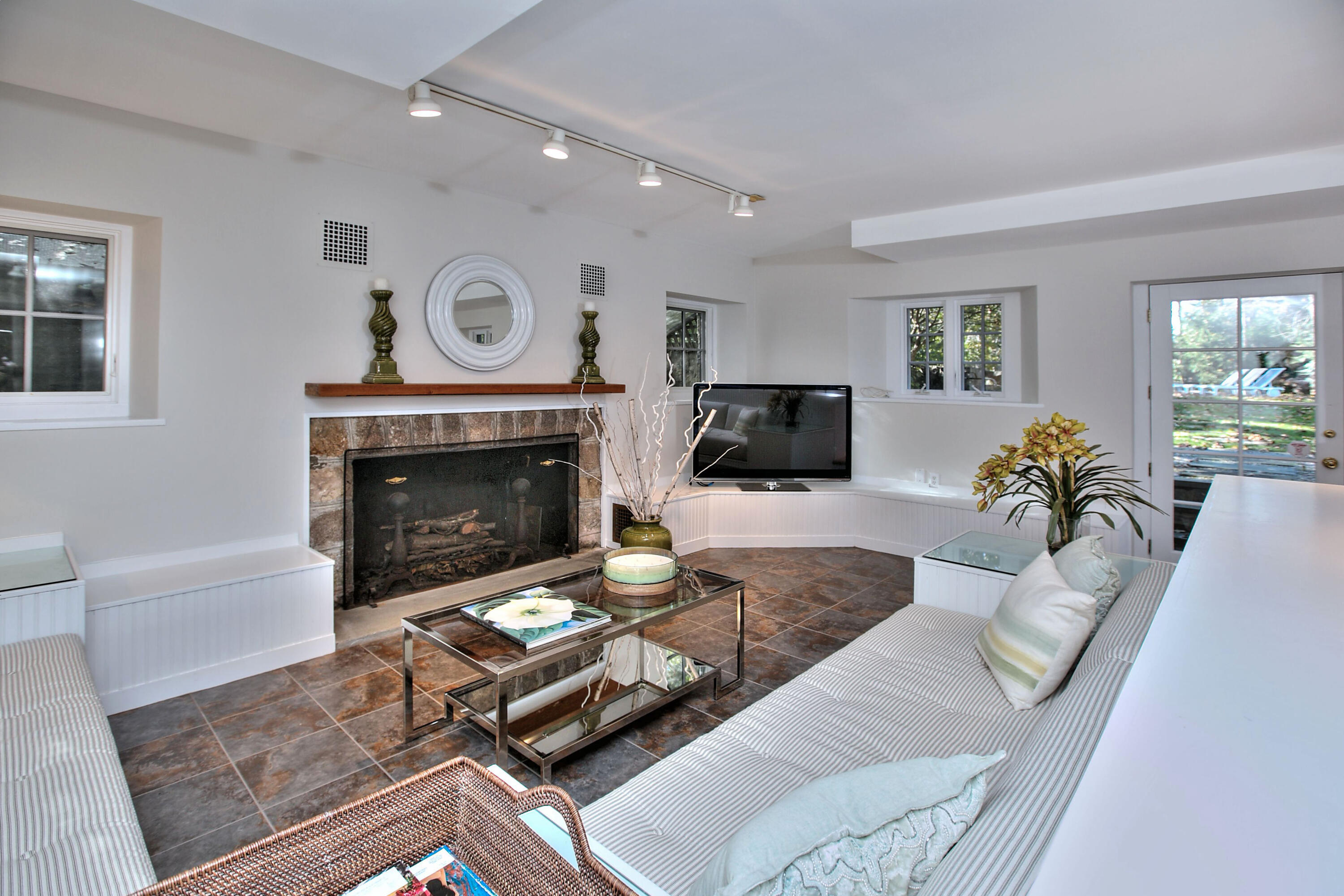 22 Mill Road New Canaan, CT 06840 - Photo 34 of 42 a living room with furniture and a fireplace