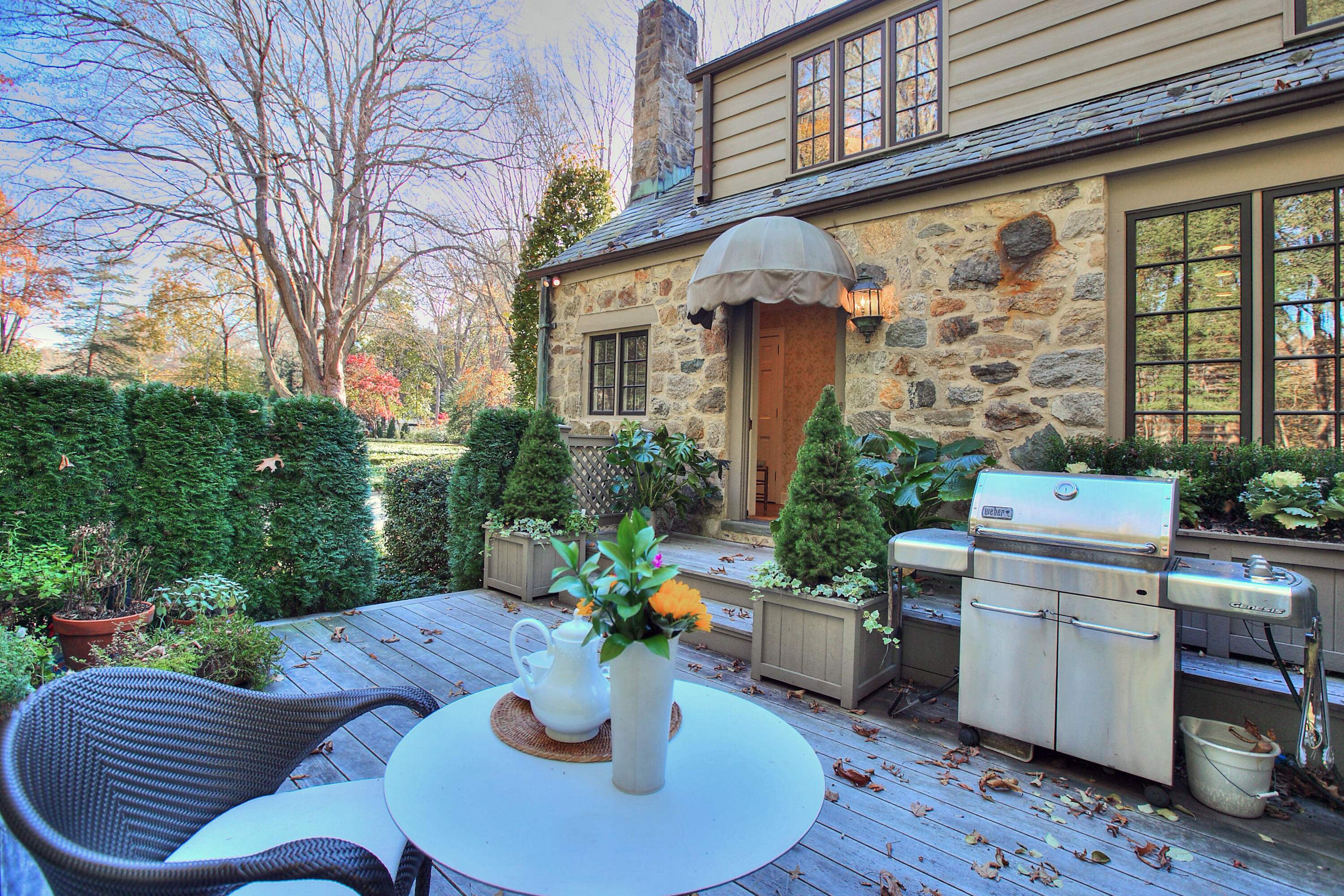 22 Mill Road New Canaan, CT 06840 - Photo 37 of 42 a view of a backyard with plants and outdoor seating