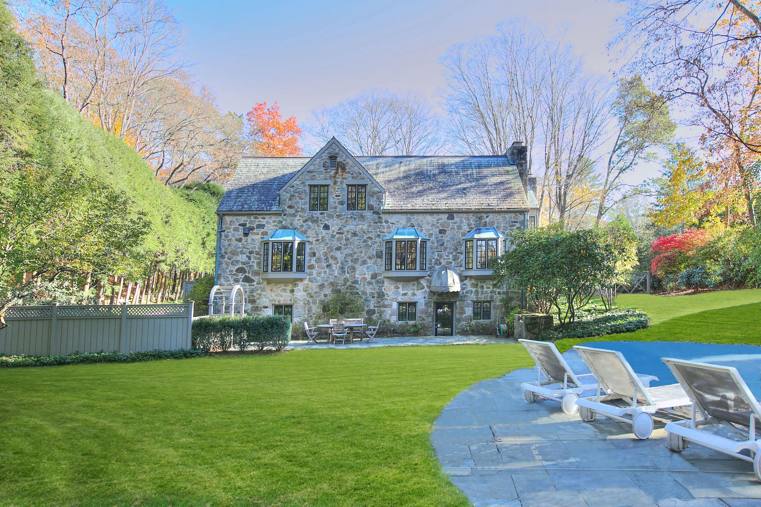 22 Mill Road New Canaan, CT 06840 - Photo 39 of 42 a view of a house with a yard porch and sitting area