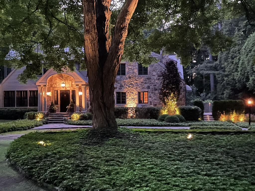 22 Mill Road New Canaan, CT 06840 - Photo 42 of 42 a front view of a house with a yard