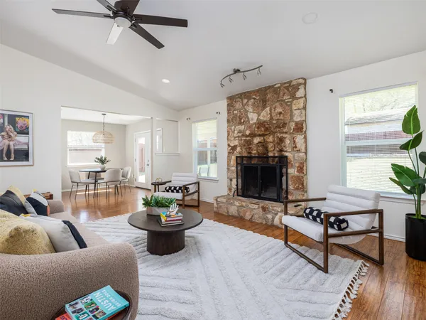 a living room with furniture and a fireplace