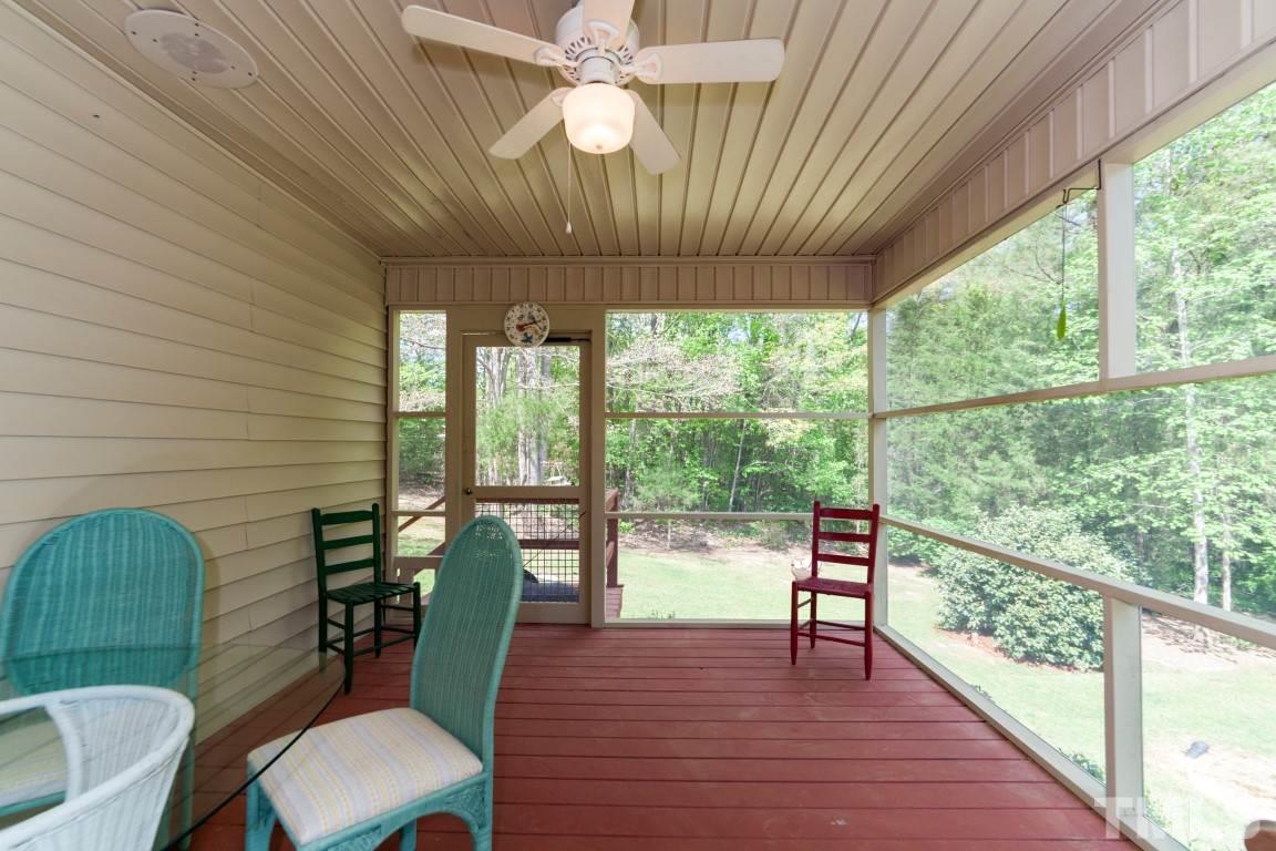 461 Hawk Road Sanford, NC 27330 - Photo 21 of 25 Enjoy your coffee while listening to the relaxing sounds of nature on your spacious screened porch!