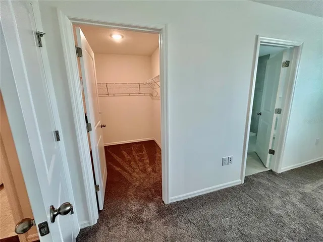a bathroom with a double vanity sink toilet and shower