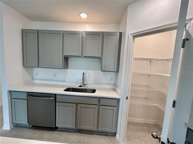 a view of kitchen and a window