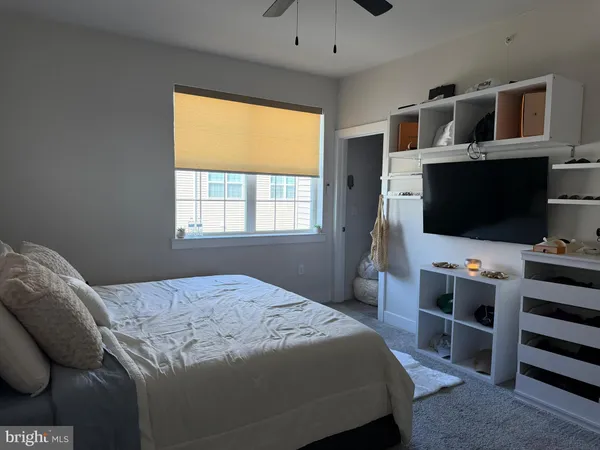 a bedroom with a bed and couch