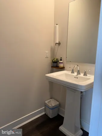 a view of a hallway with closet and mirror