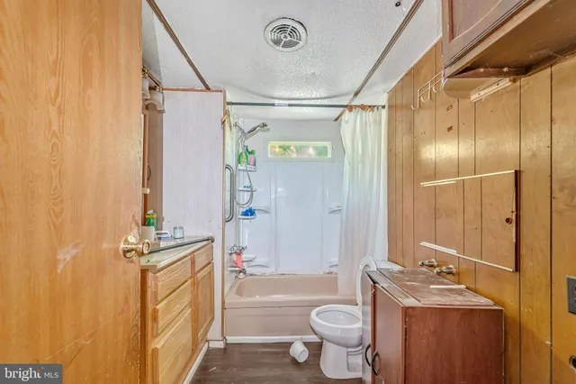 a view of a livingroom with furniture and staircase