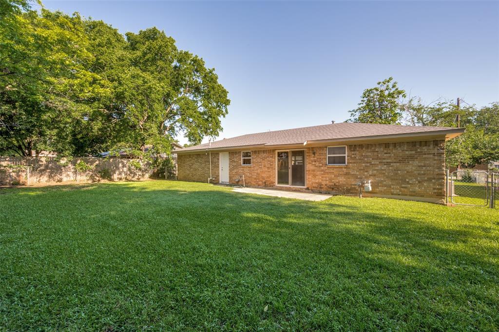 709 East Main Street Pilot Point, TX 76258 - Photo 11 of 11 a front view of a house with a garden