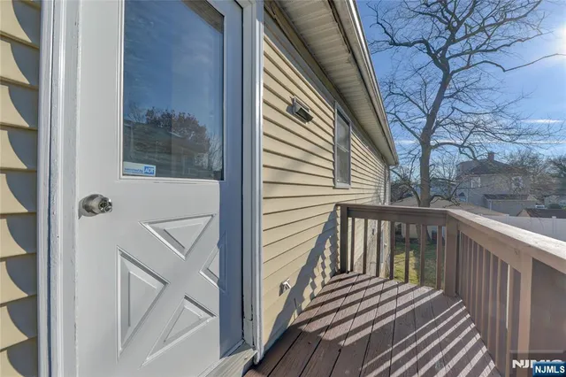 a view of a balcony with wooden floor and floor
