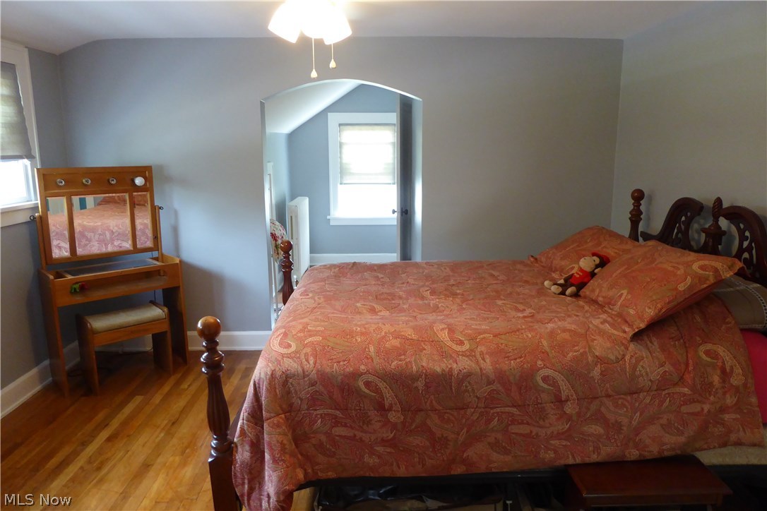 496 Babbitt Road Euclid, OH 44123 - Photo 16 of 31 One of Two Upstairs Bedrooms - This Could Also Be a Master Bedroom as there is a Full Bath Right off this Room, the Arched Doorway is Where the Closet is Located! Beautiful Hardwood Flooring, Ceiling Fan, Plenty of Windows !!!