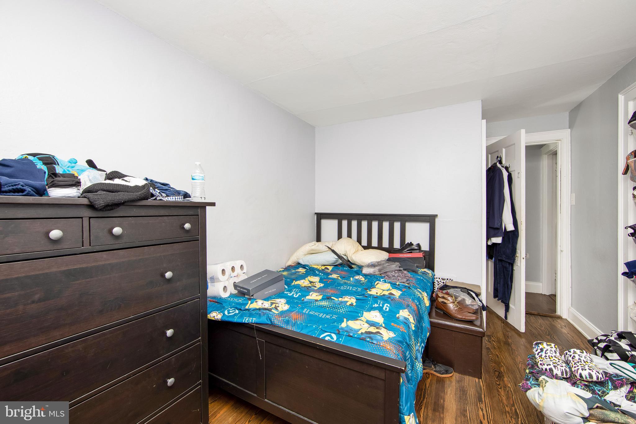 2832 Kansas Road Camden, NJ 08104 - Photo 12 of 32 a bed room with a bed and a dresser