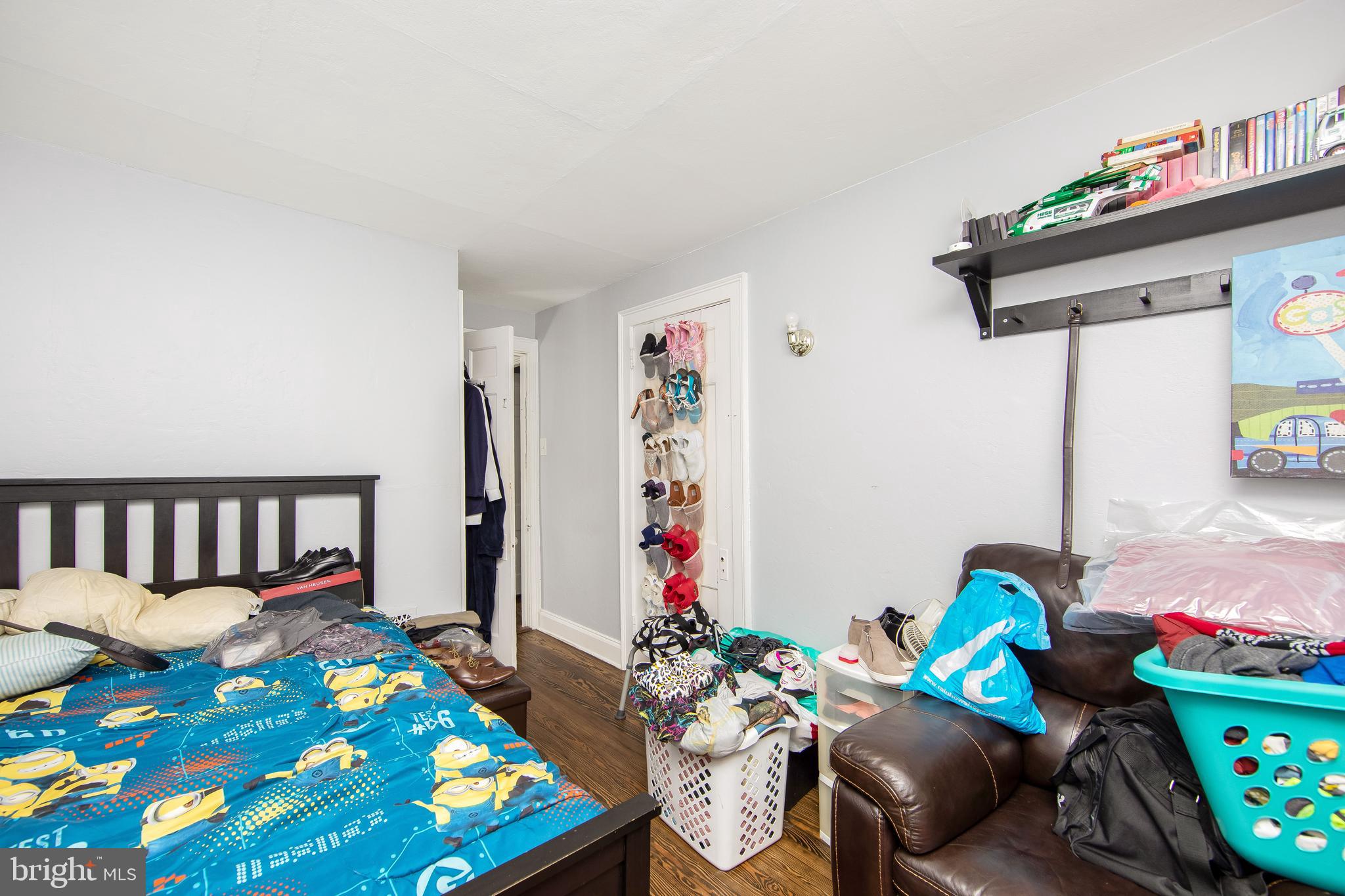 2832 Kansas Road Camden, NJ 08104 - Photo 13 of 32 a bedroom with furniture and a wooden floor