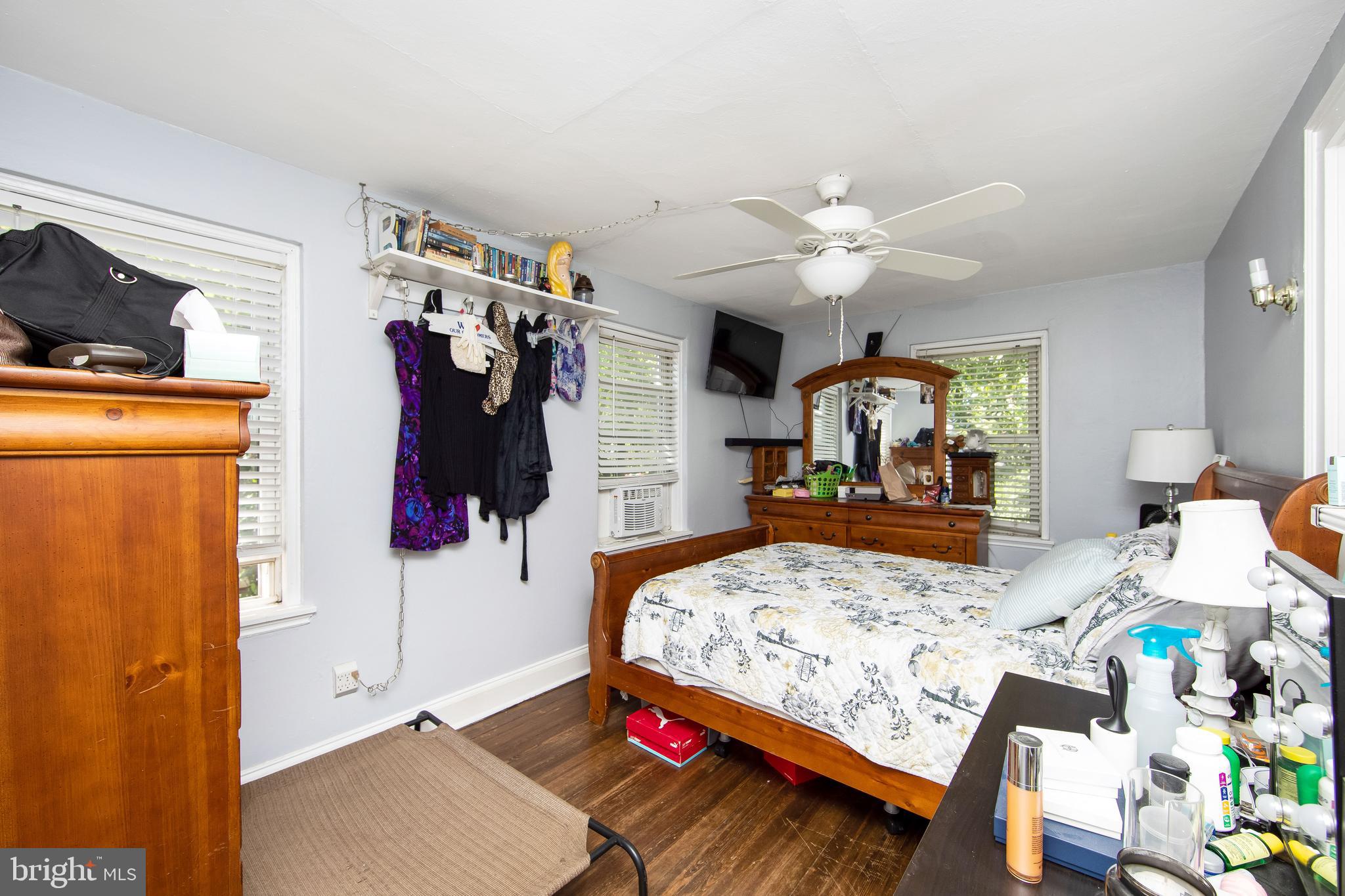 2832 Kansas Road Camden, NJ 08104 - Photo 14 of 32 a bedroom that has a bed and a chandelier