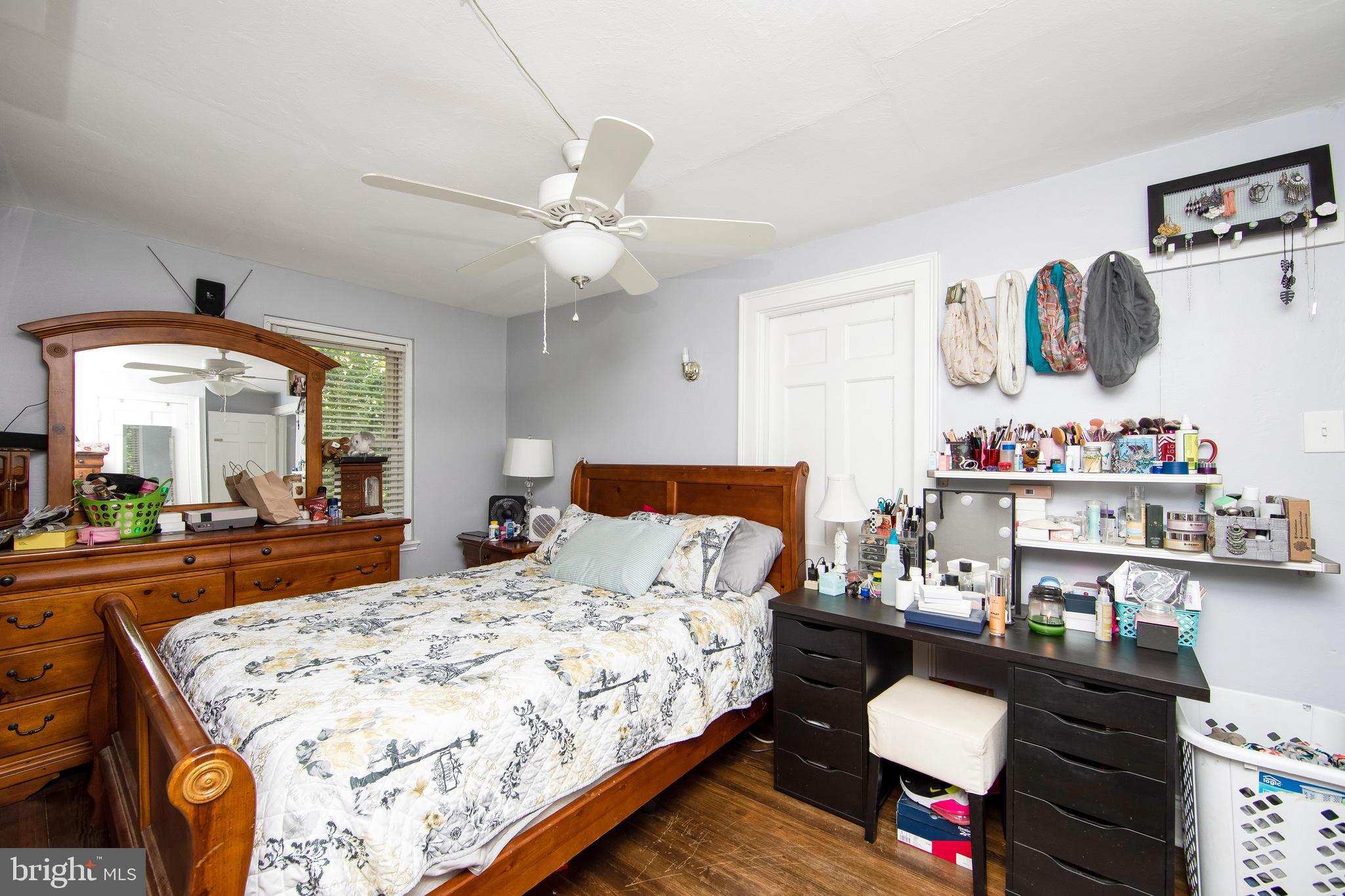 2832 Kansas Road Camden, NJ 08104 - Photo 15 of 32 a bedroom with a bed and dresser
