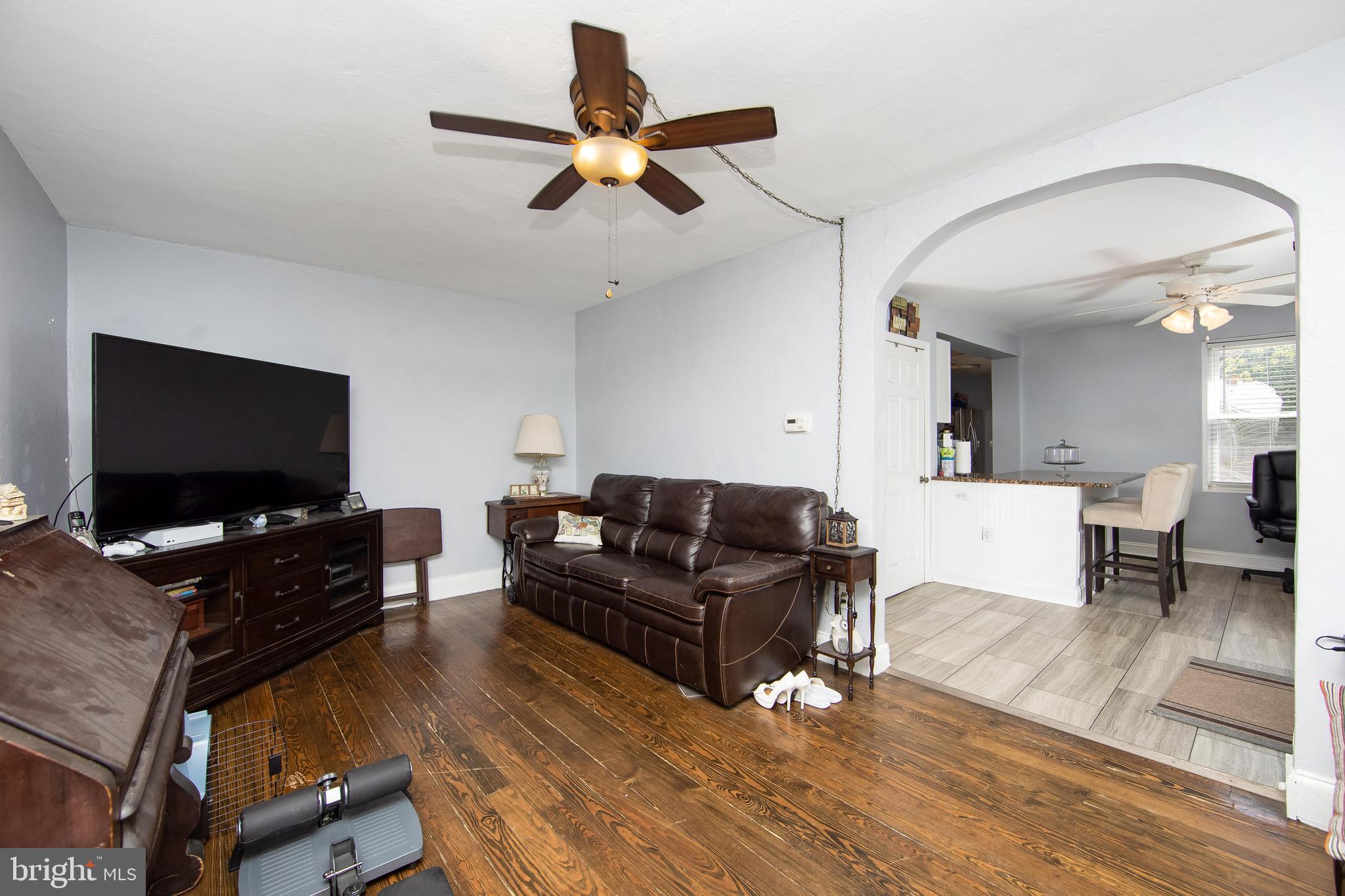 2832 Kansas Road Camden, NJ 08104 - Photo 24 of 32 a living room with furniture and a flat screen tv