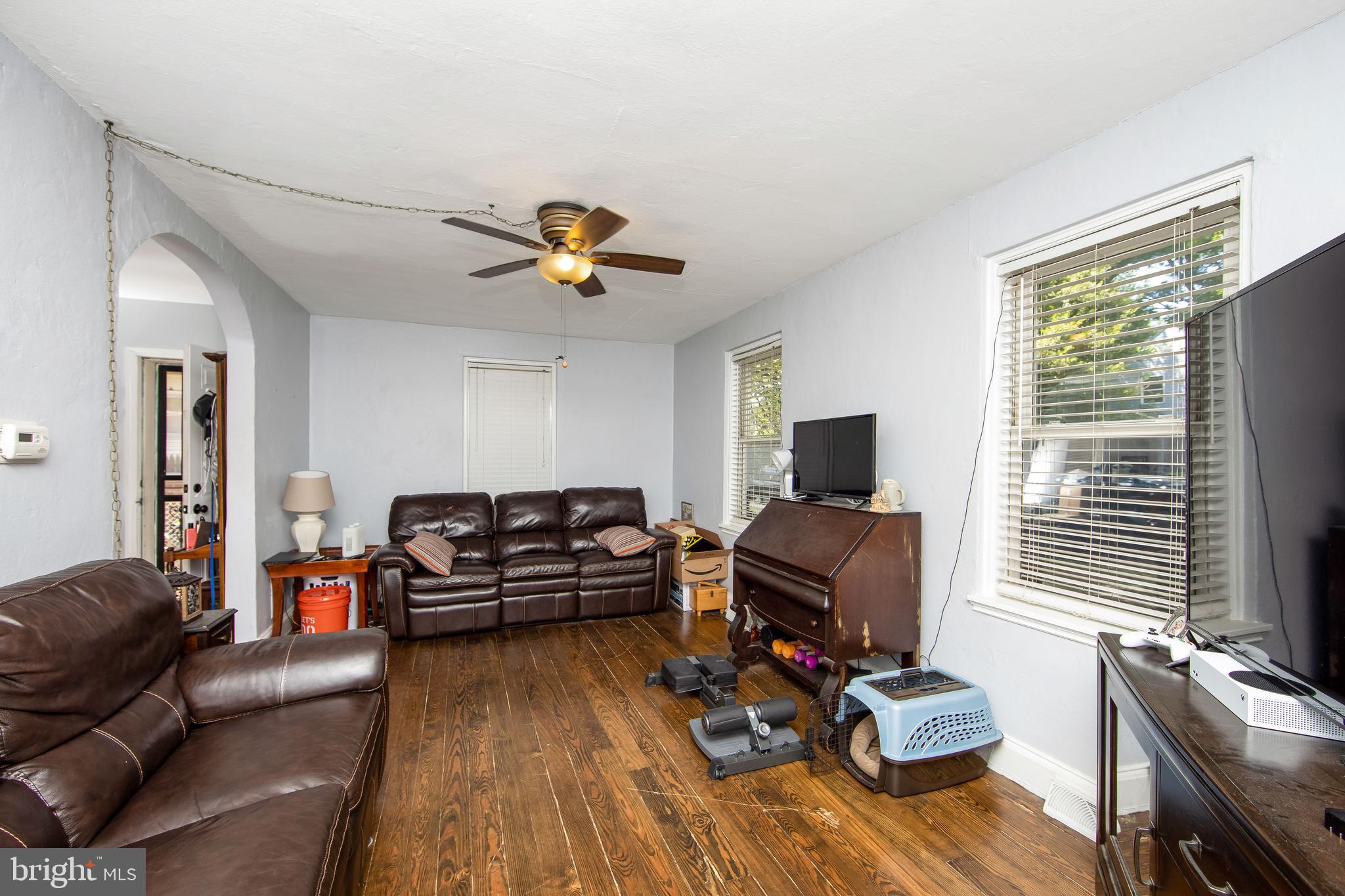 2832 Kansas Road Camden, NJ 08104 - Photo 25 of 32 a living room with furniture and a flat screen tv
