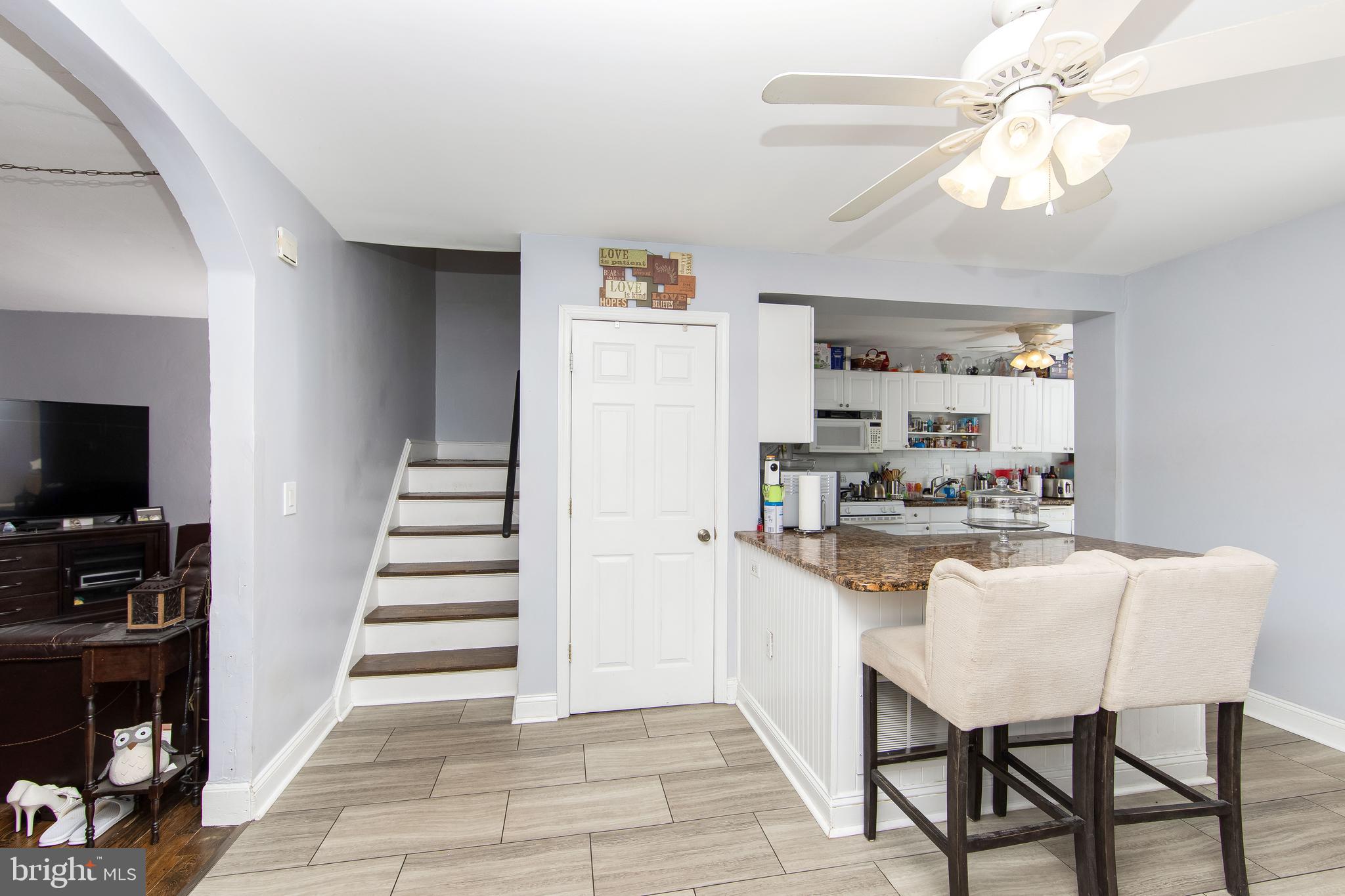 2832 Kansas Road Camden, NJ 08104 - Photo 6 of 32 a kitchen with stainless steel appliances kitchen island granite countertop a refrigerator and a stove top oven