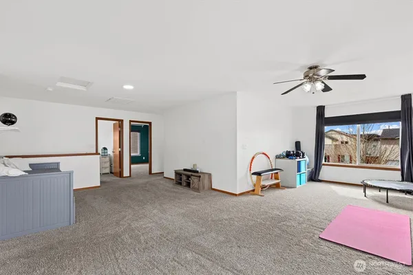a view of game room with window and couch