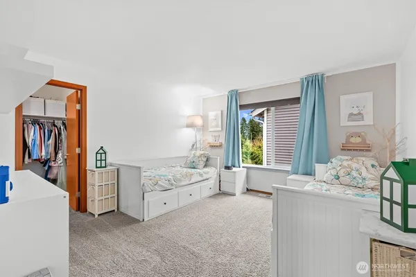 a bed room with a bed and a window