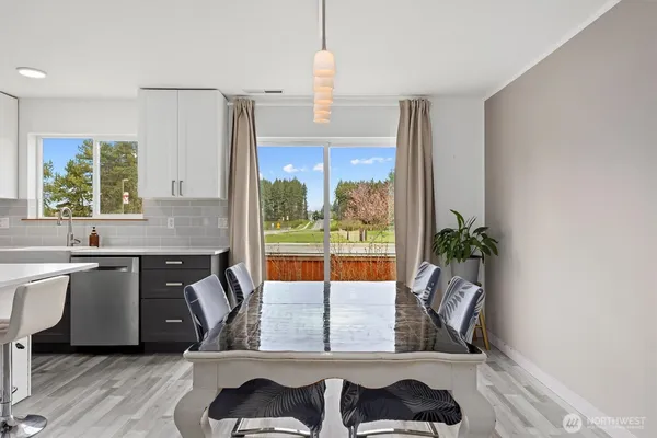 a kitchen with a window a sink and a counter top space