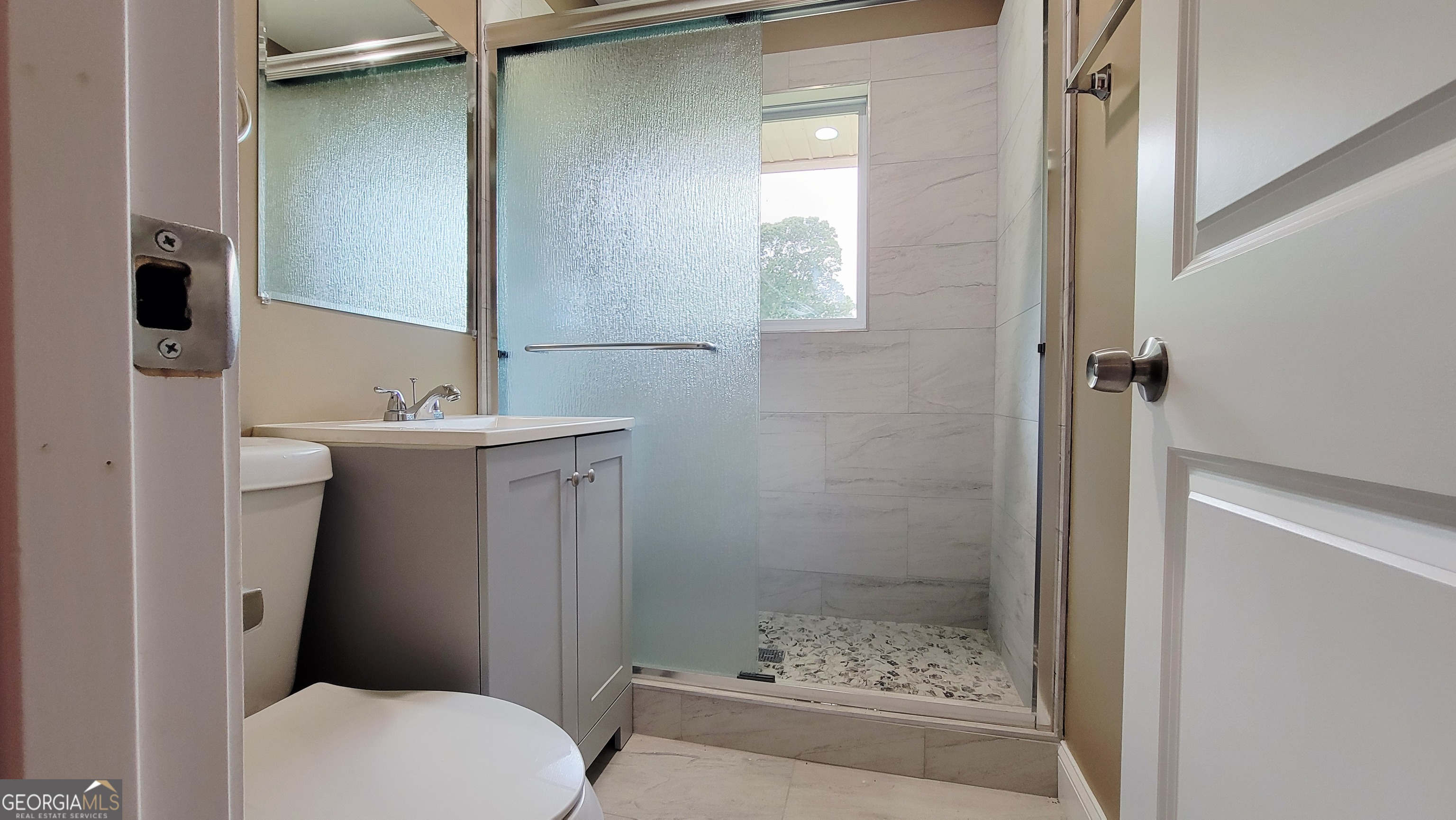 4491 Glade Road Forest Park, GA 30297 - Photo 16 of 41 a bathroom with a sink a toilet and shower