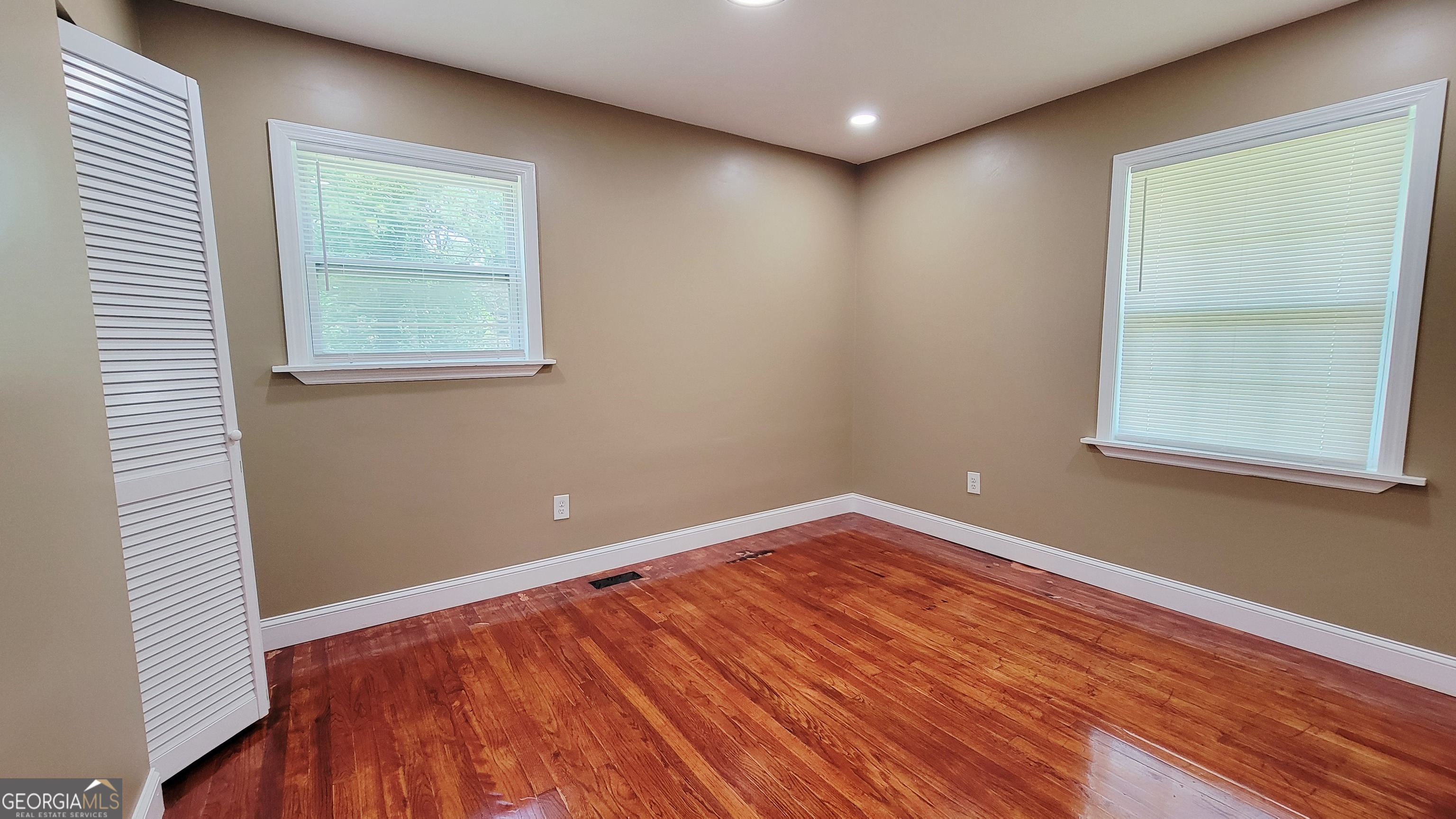 4491 Glade Road Forest Park, GA 30297 - Photo 19 of 41 a view of a room with wooden floor and windows