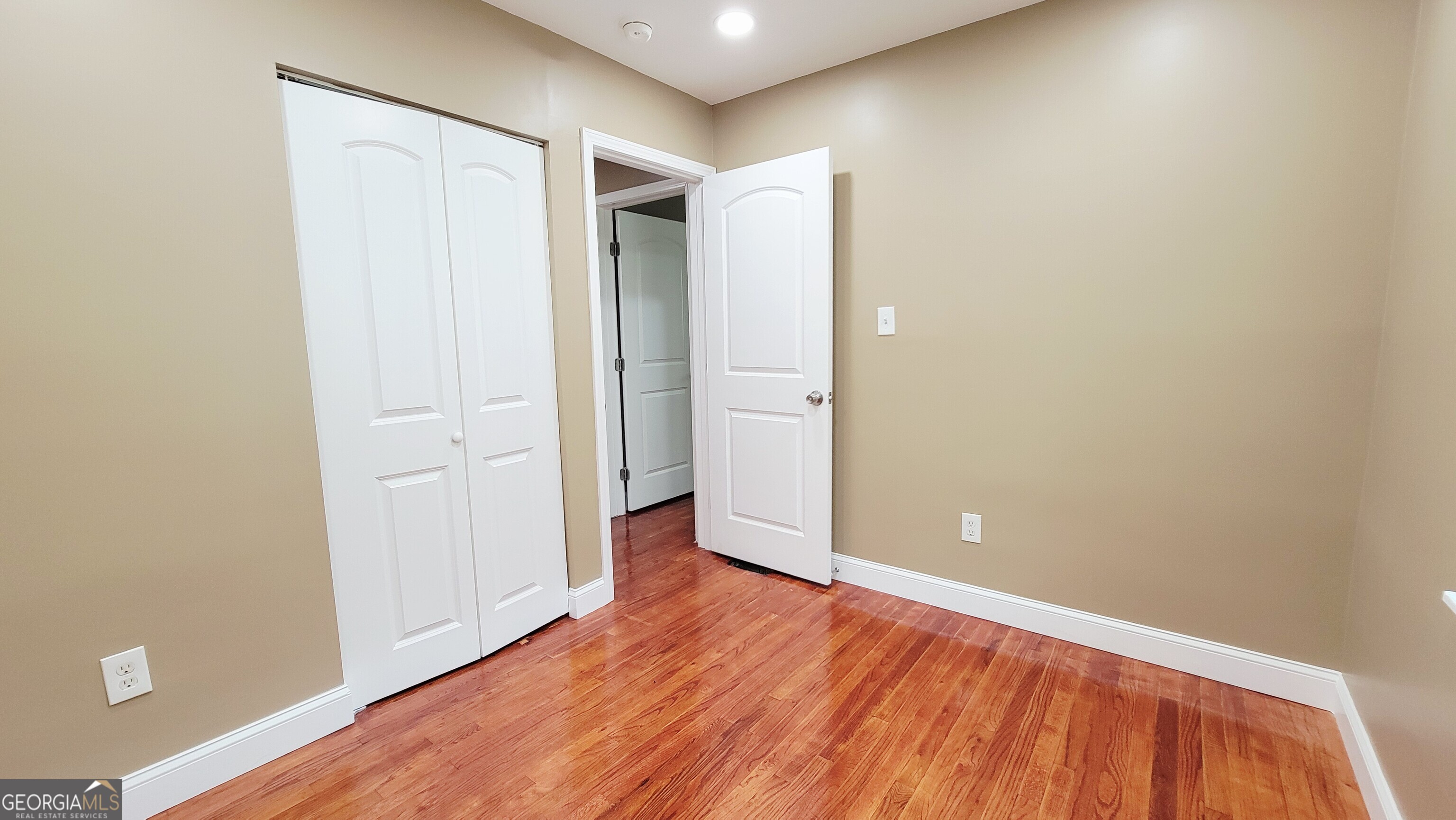 4491 Glade Road Forest Park, GA 30297 - Photo 22 of 41 a view of an empty room with wooden floor