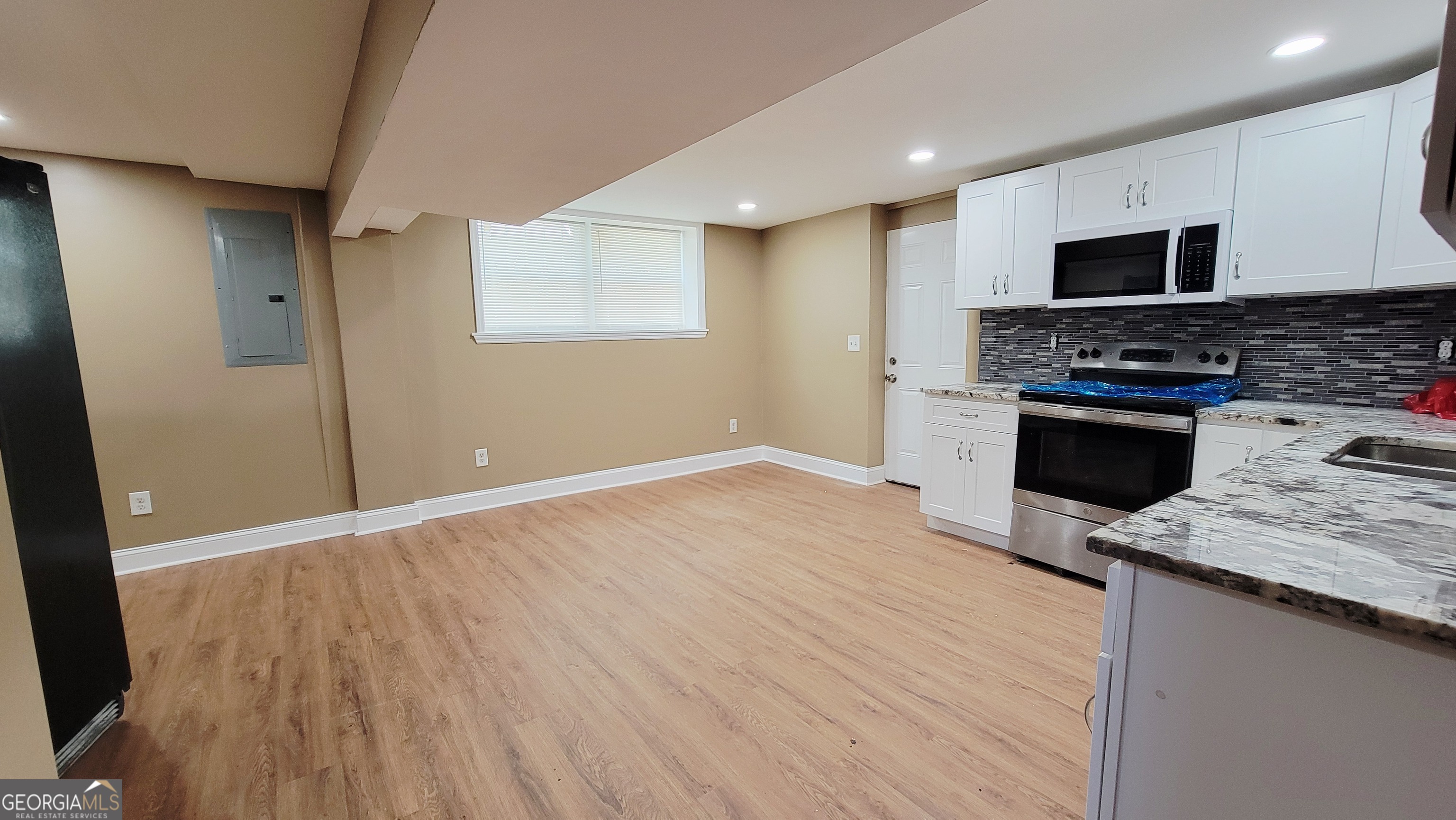 4491 Glade Road Forest Park, GA 30297 - Photo 23 of 41 a view of a kitchen with microwave and stove