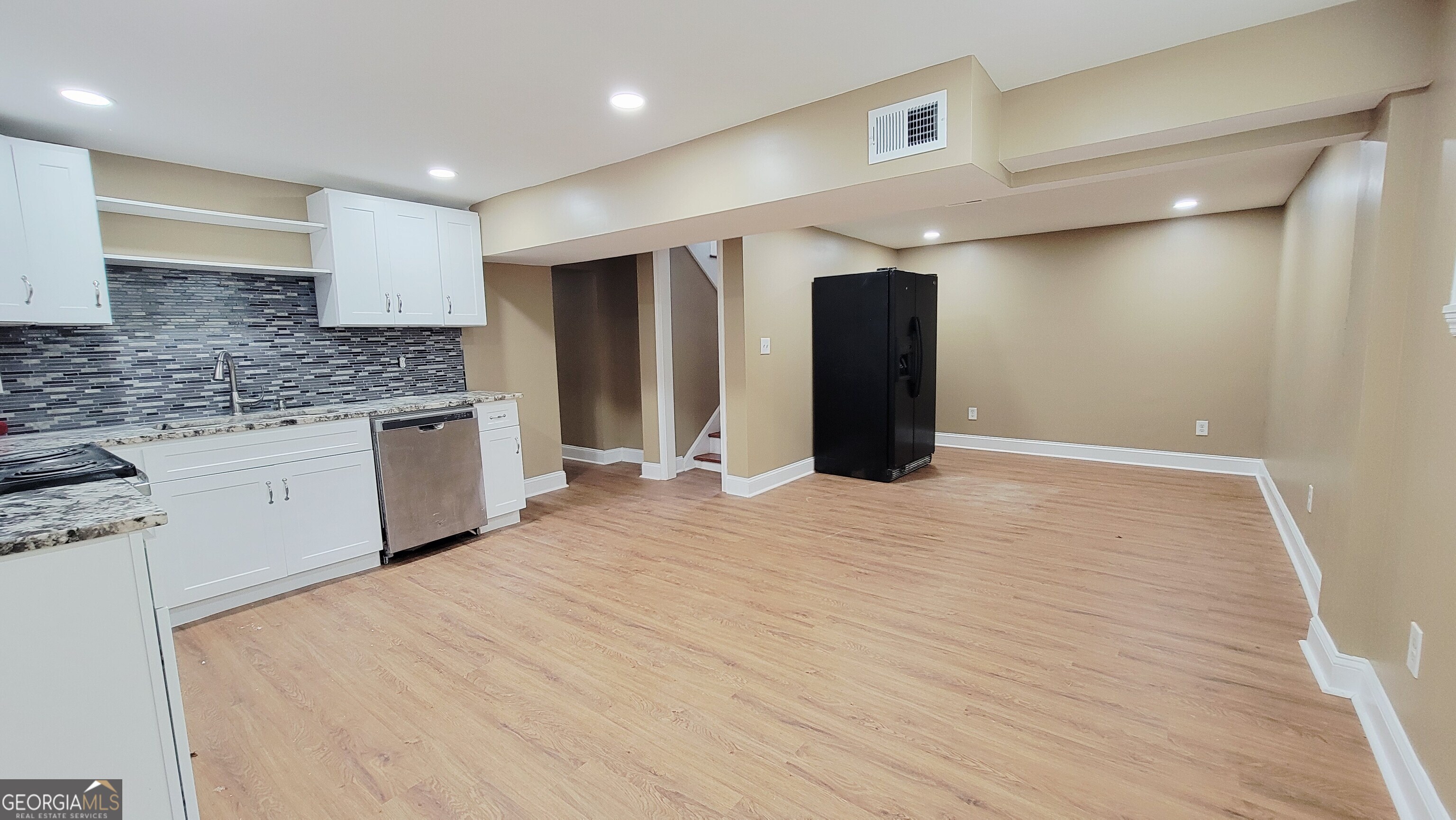 4491 Glade Road Forest Park, GA 30297 - Photo 26 of 41 a large white kitchen with a sink