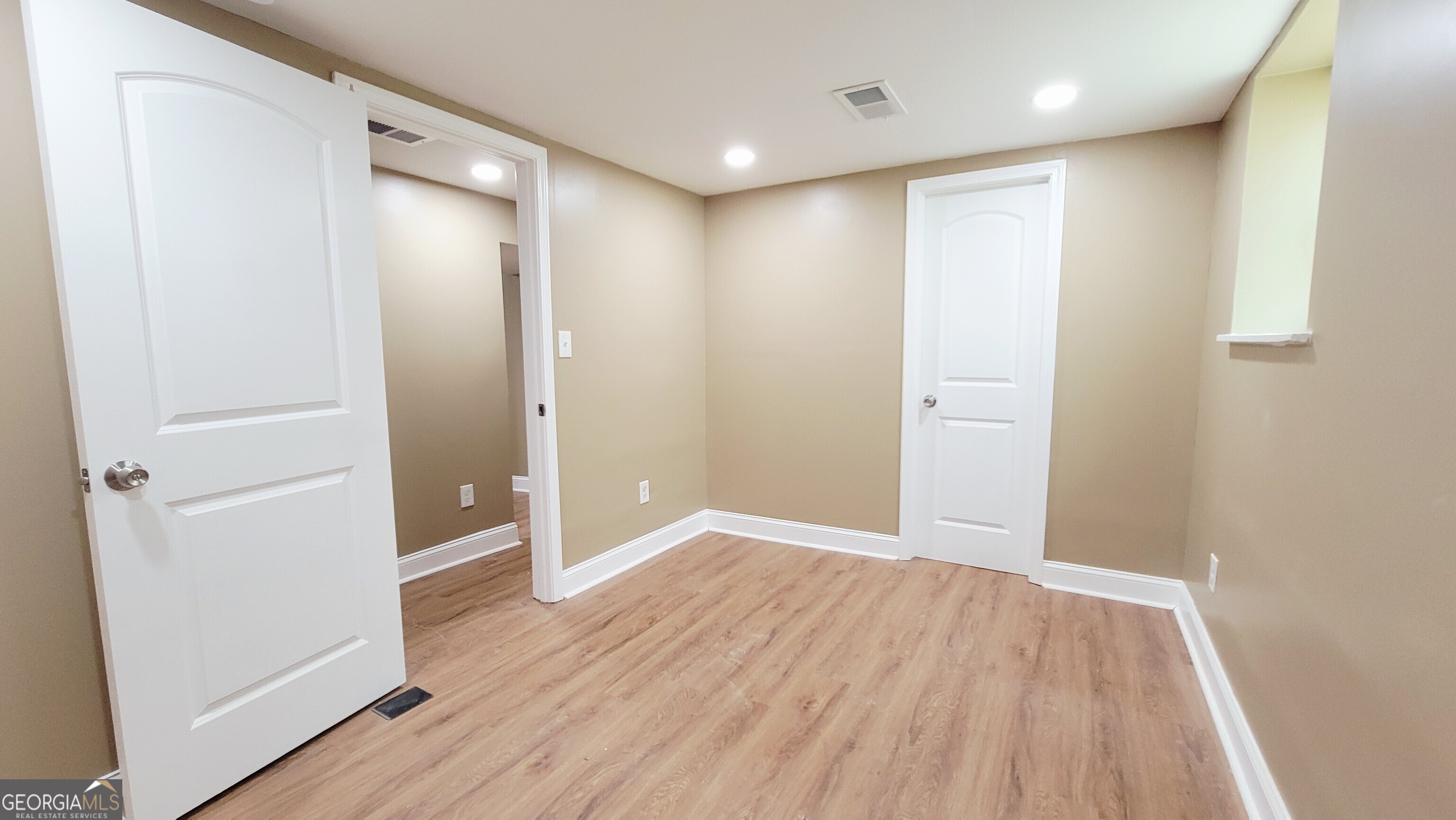 4491 Glade Road Forest Park, GA 30297 - Photo 30 of 41 wooden floor in an empty room with wooden floor