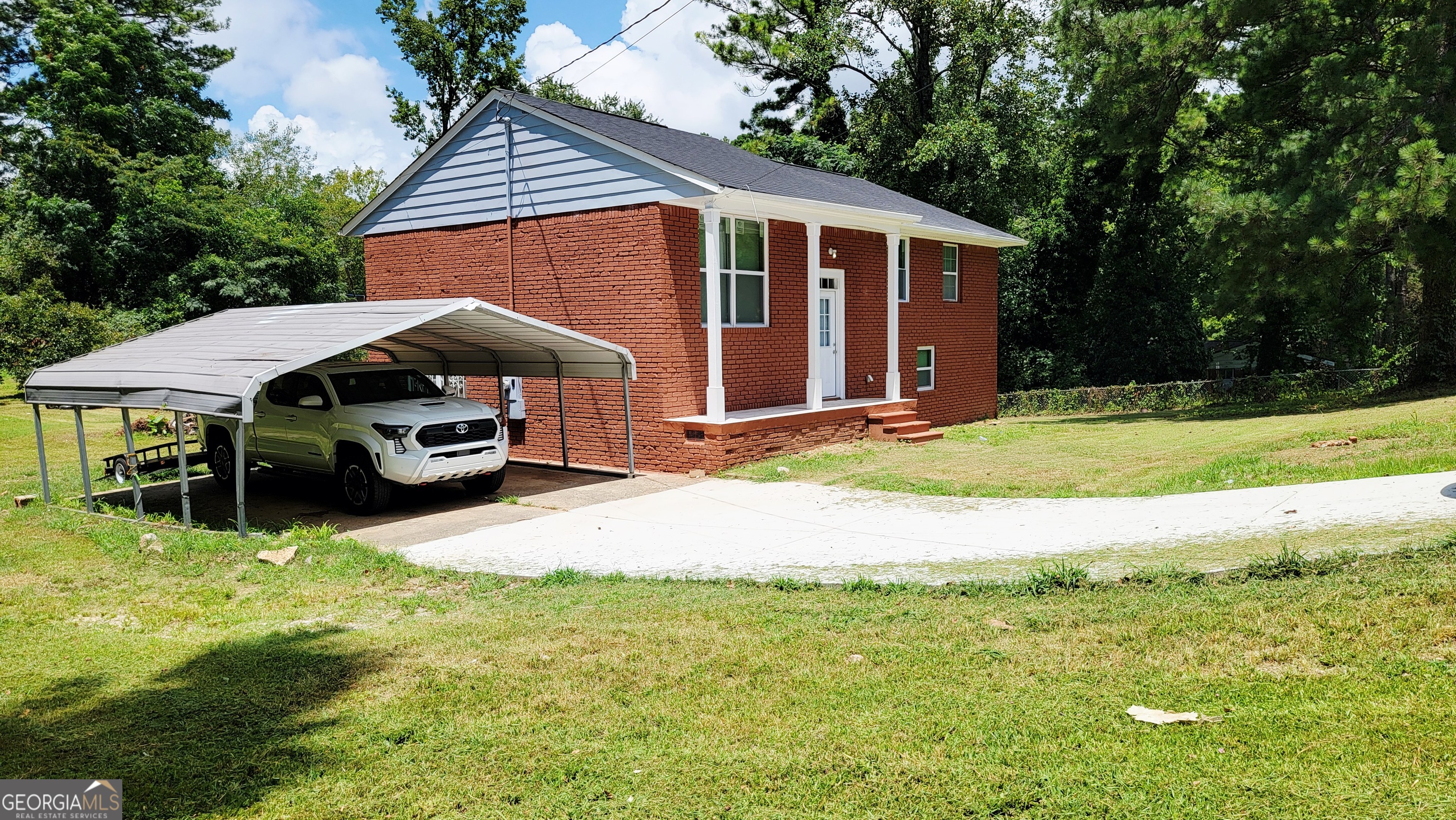 4491 Glade Road Forest Park, GA 30297 - Photo 3 of 41 a front view of a house with a yard