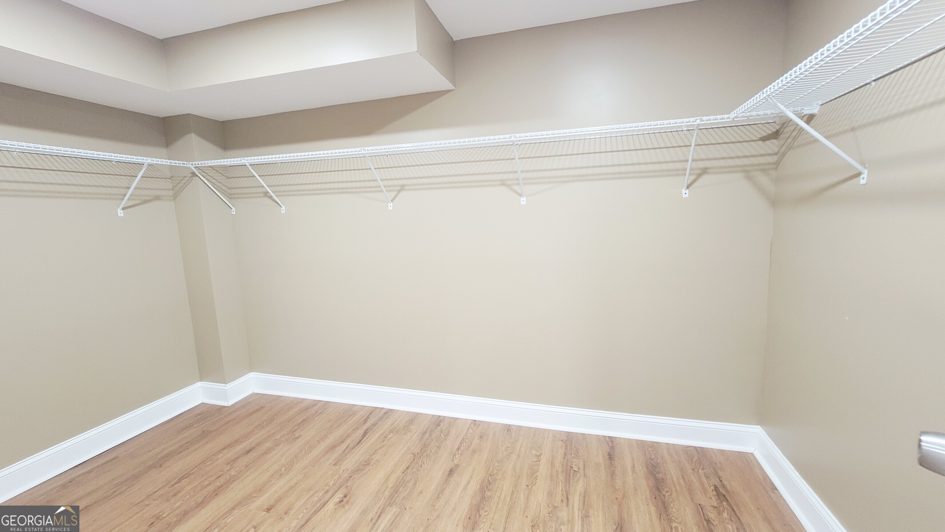 4491 Glade Road Forest Park, GA 30297 - Photo 31 of 41 a view of an empty walk in closet