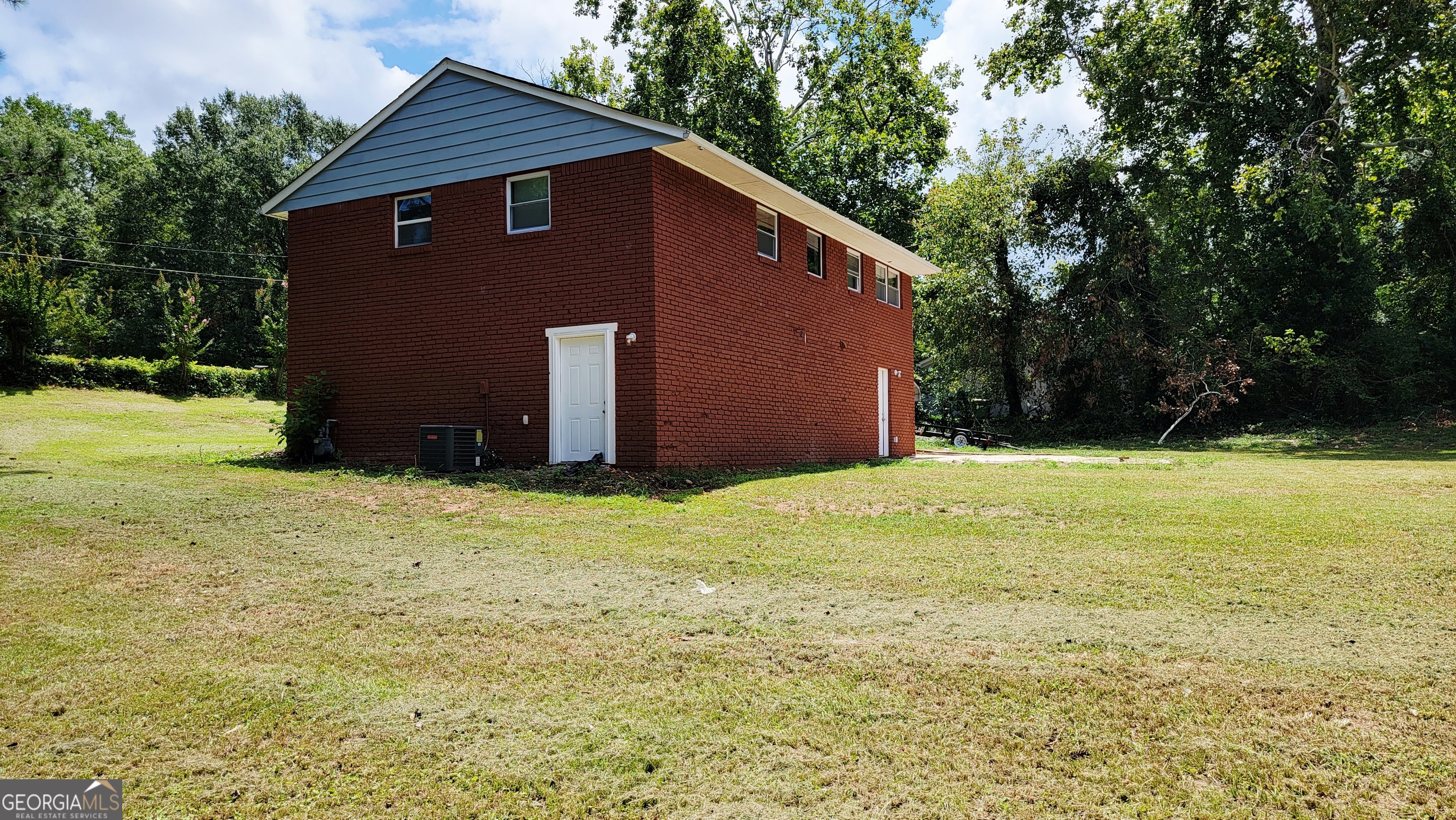 4491 Glade Road Forest Park, GA 30297 - Photo 39 of 41 a front view of house with yard and trees