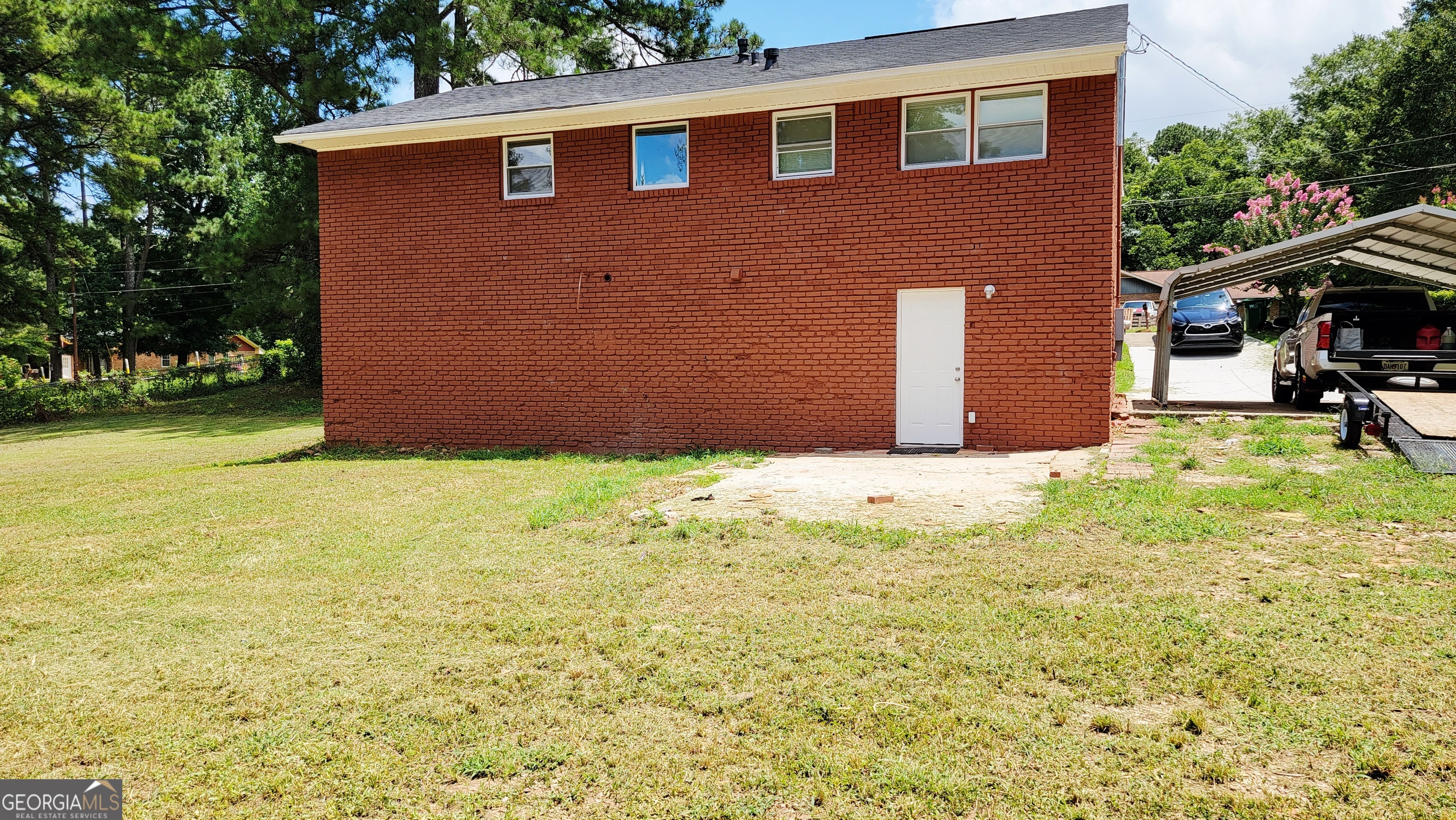 4491 Glade Road Forest Park, GA 30297 - Photo 41 of 41 a backyard of a house with yard and outdoor seating