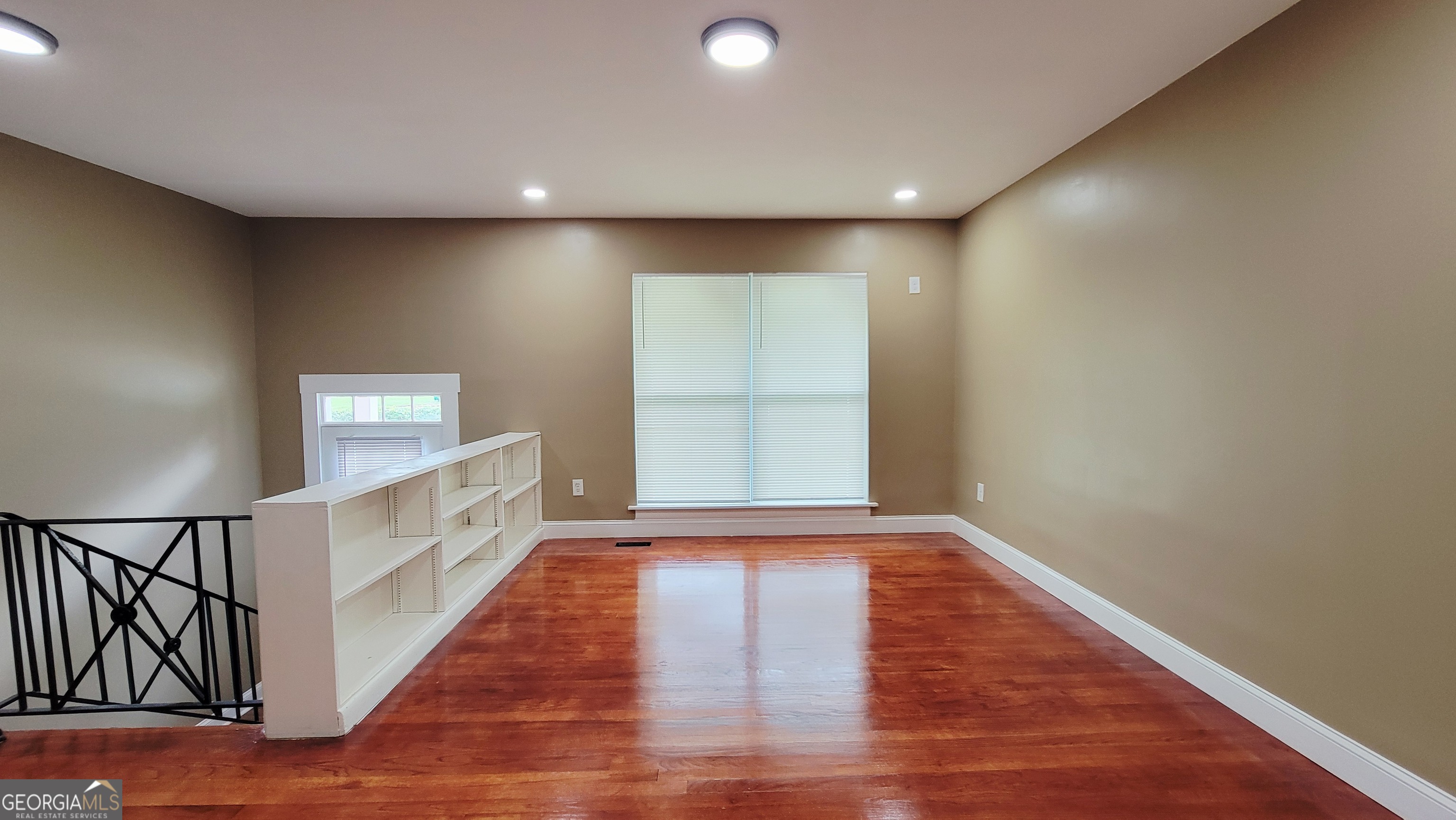 4491 Glade Road Forest Park, GA 30297 - Photo 7 of 41 a view of room with window and hardwood floor
